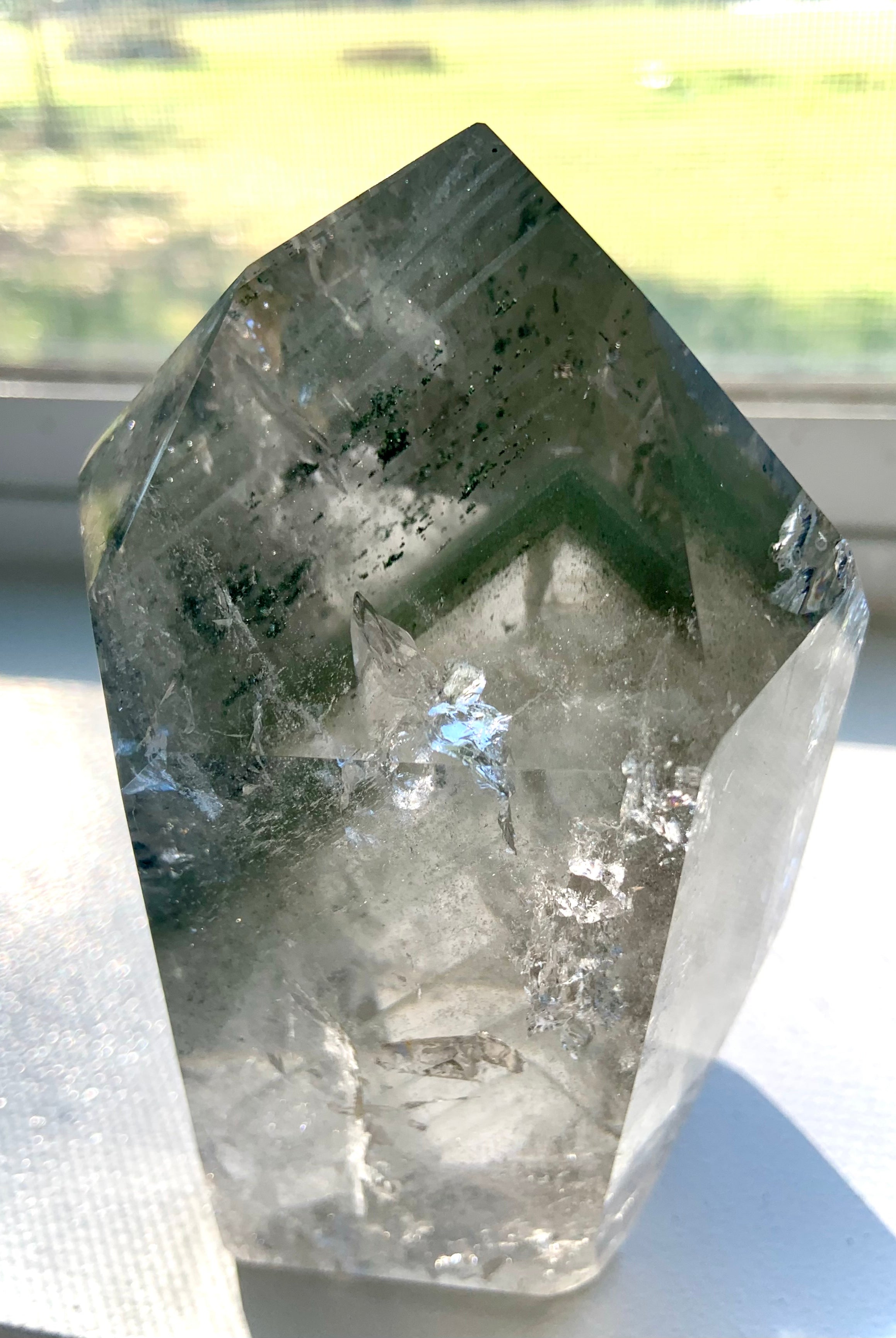 A Garden Quartz Lodolite Crystal with chlorite phantoms, mossy mineral inclusions + tons of rainbows