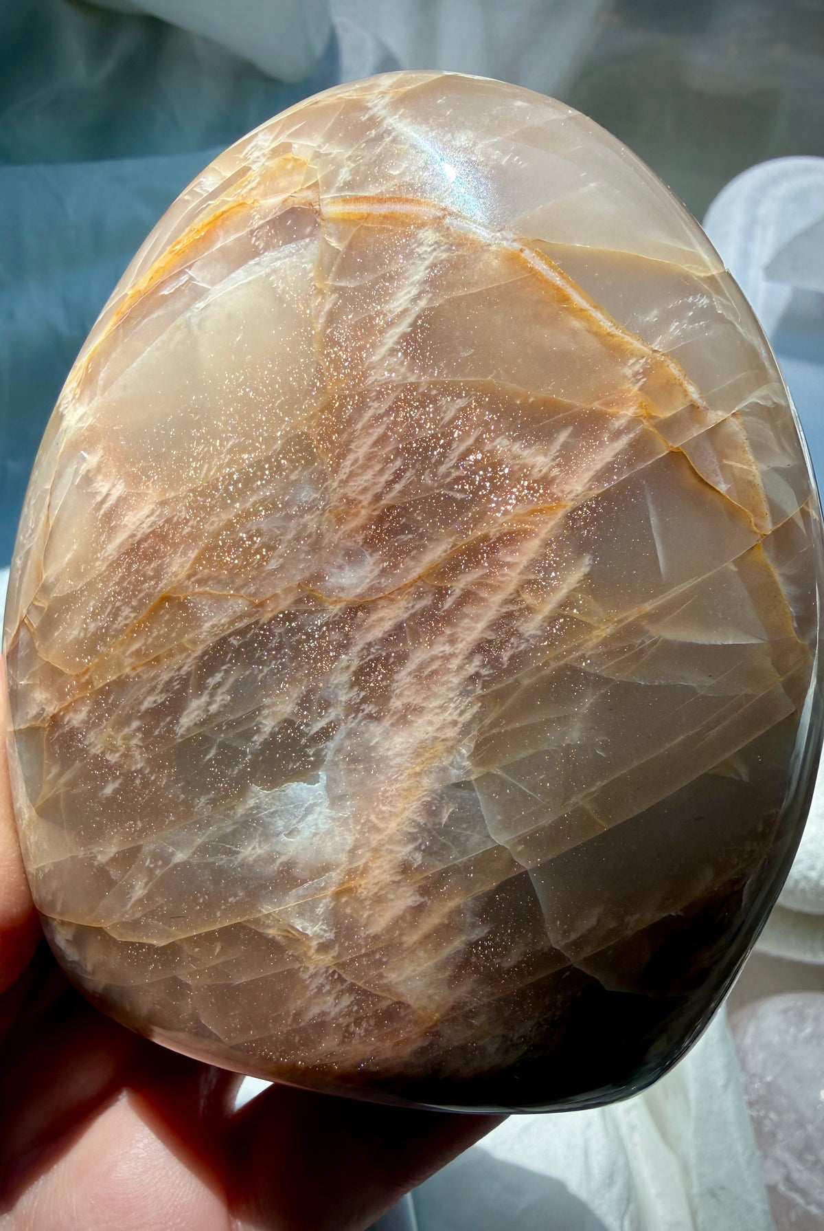 Peach Moonstone with Sunstone inclusions showing glittery golden shimmer, peach orange color and natural mineral patterns