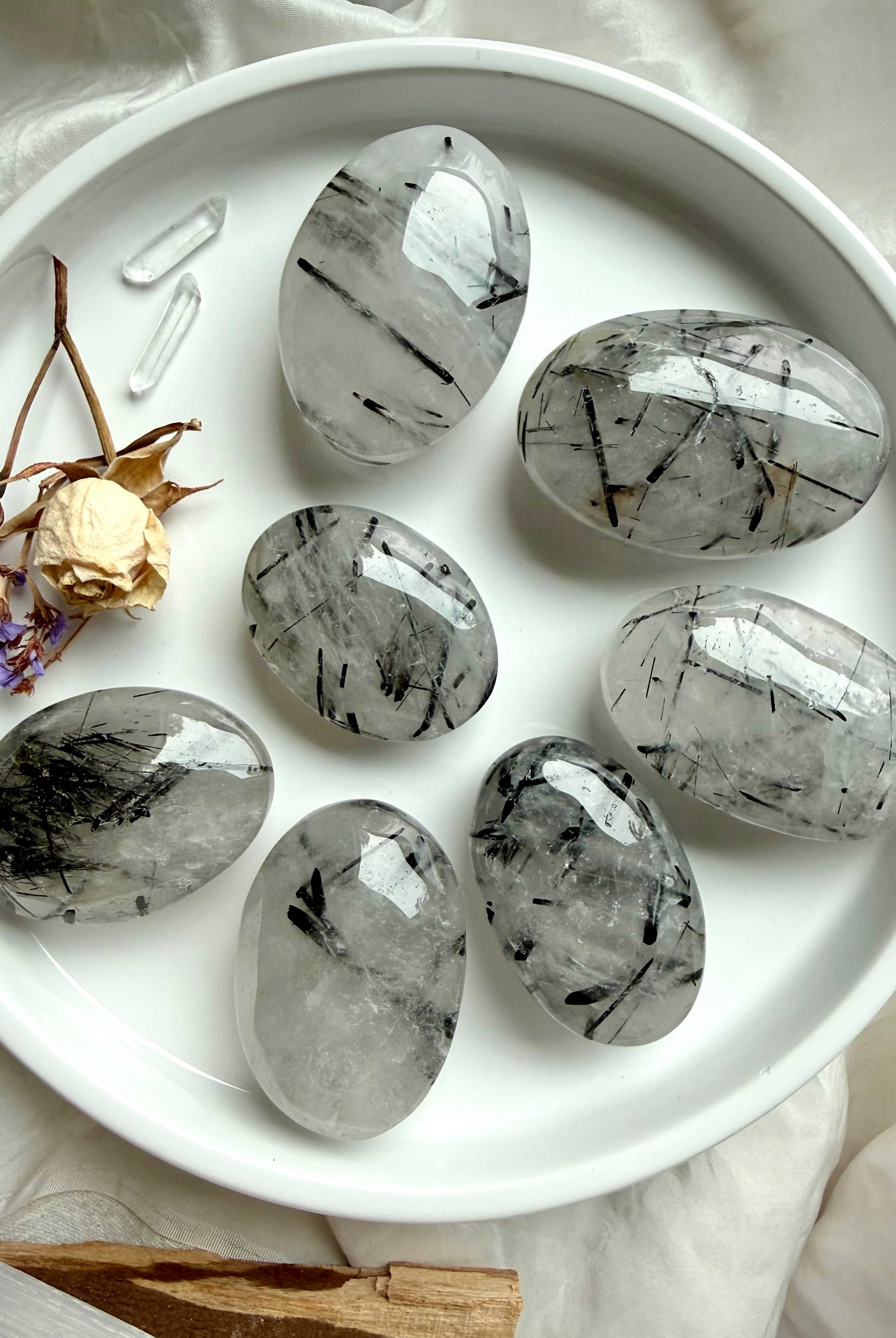 back view Black Tourmaline in Quartz palm stones showing natural tourmaline inclusions in clear quartz