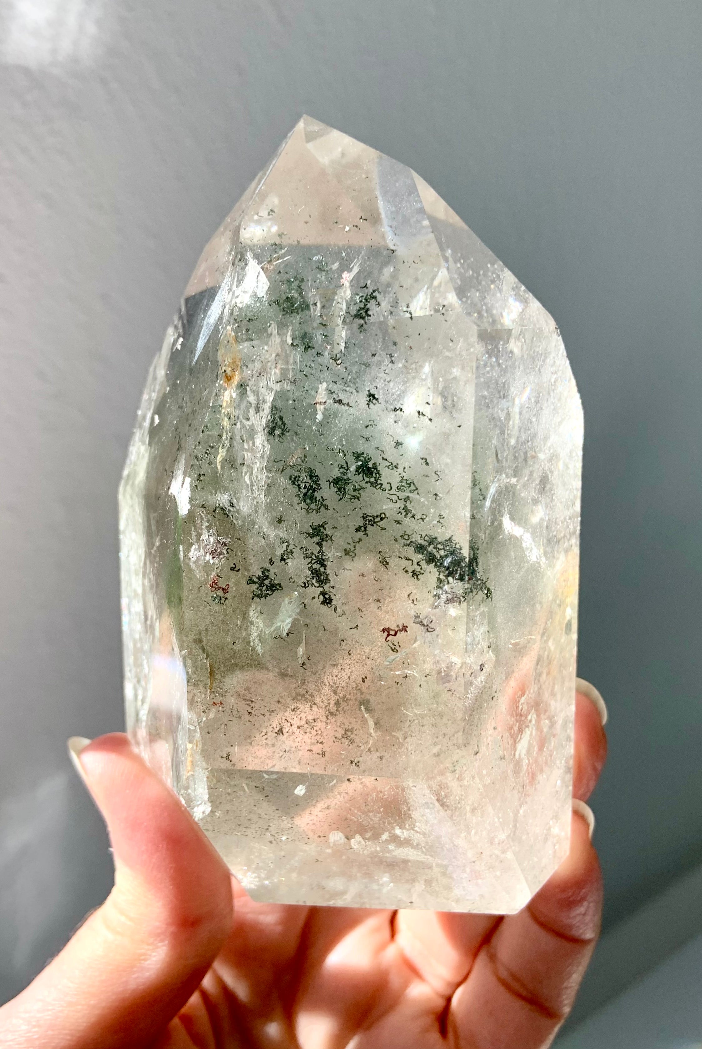 This Garden Quartz Specimen held to the light showing chlorite phantoms & mossy mineral inclusions