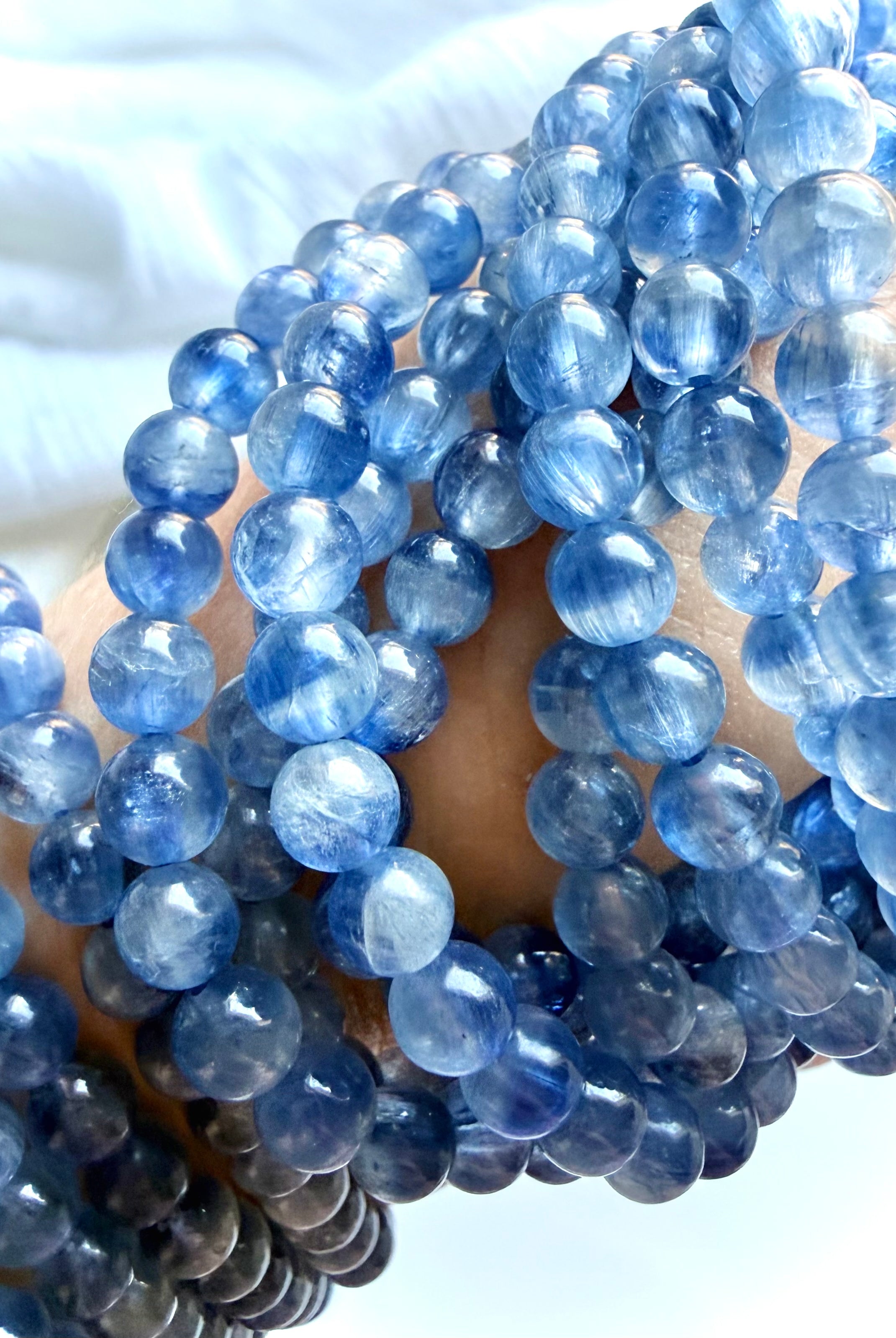 Blue Kyanite healing crystal bracelets showing translucent blue gemstones with layered natural color