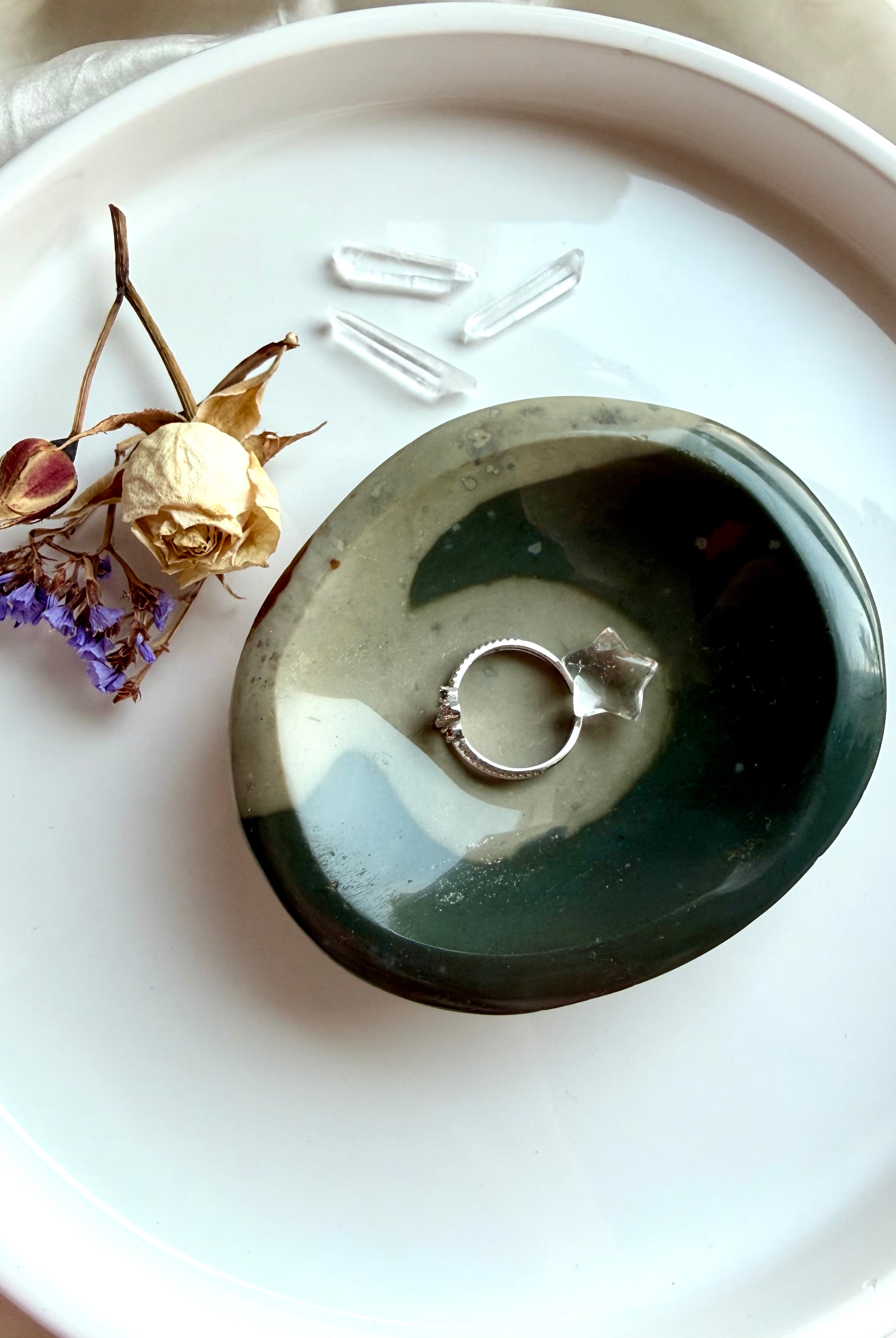 polychrome jasper crystal bowl styled with jewelry on tray with selenite and palo santo