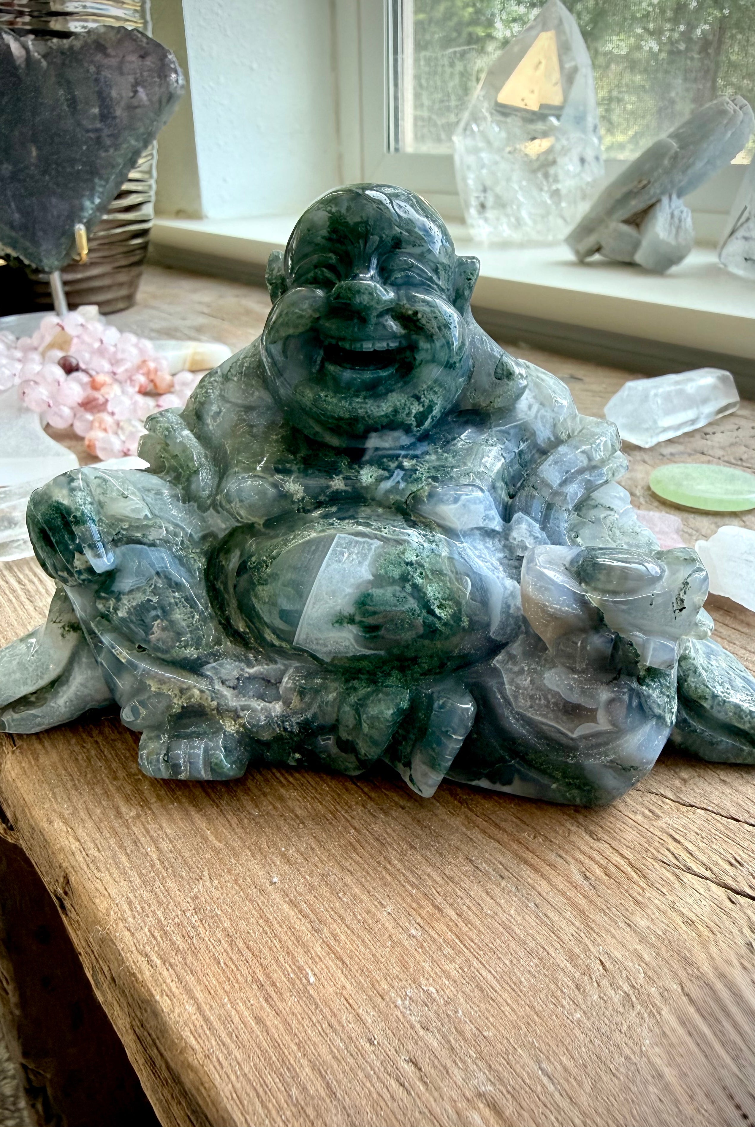 Large Moss Agate Laughing Buddha crystal statue with scenic inclusions for prosperity, abundance, and Feng Shui