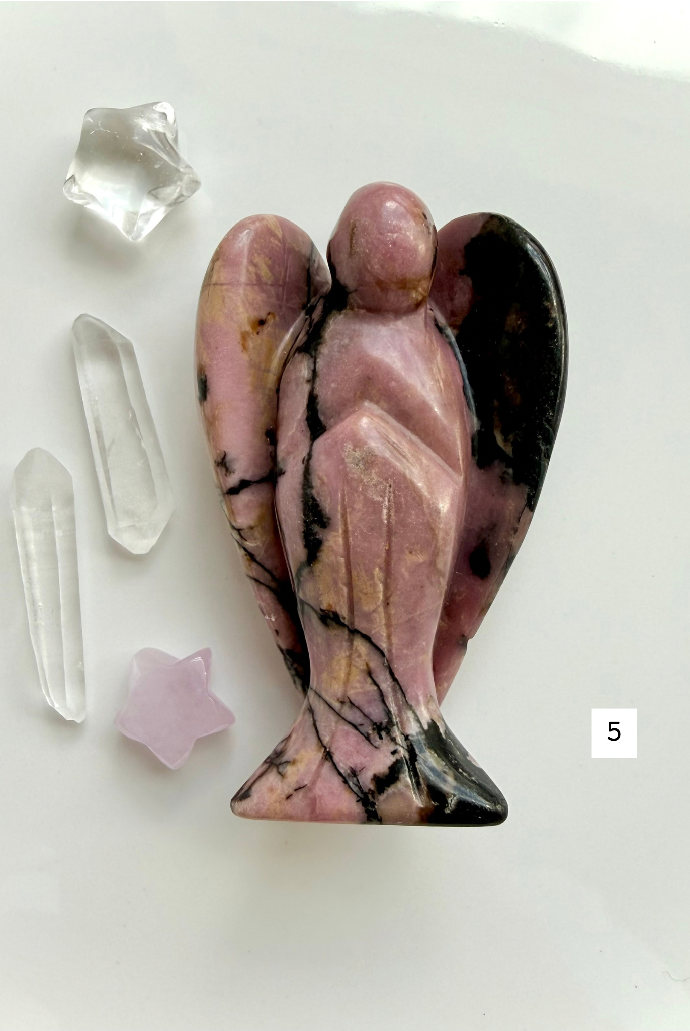 Polished Rhodonite angel crystal with rich rose tones for comfort and self-love