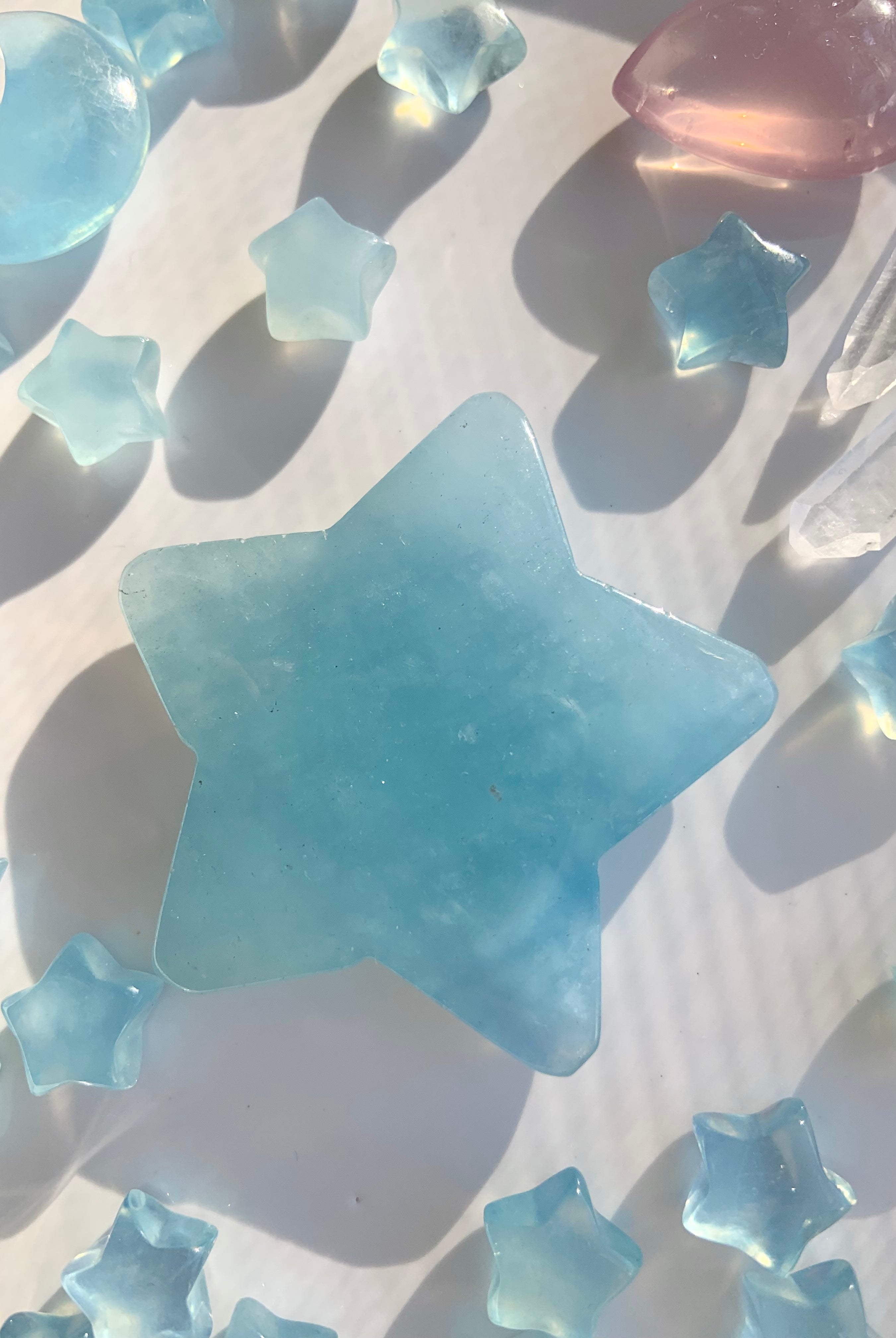Larger Aquamarine star surrounded by smaller crystals with calming ocean tones