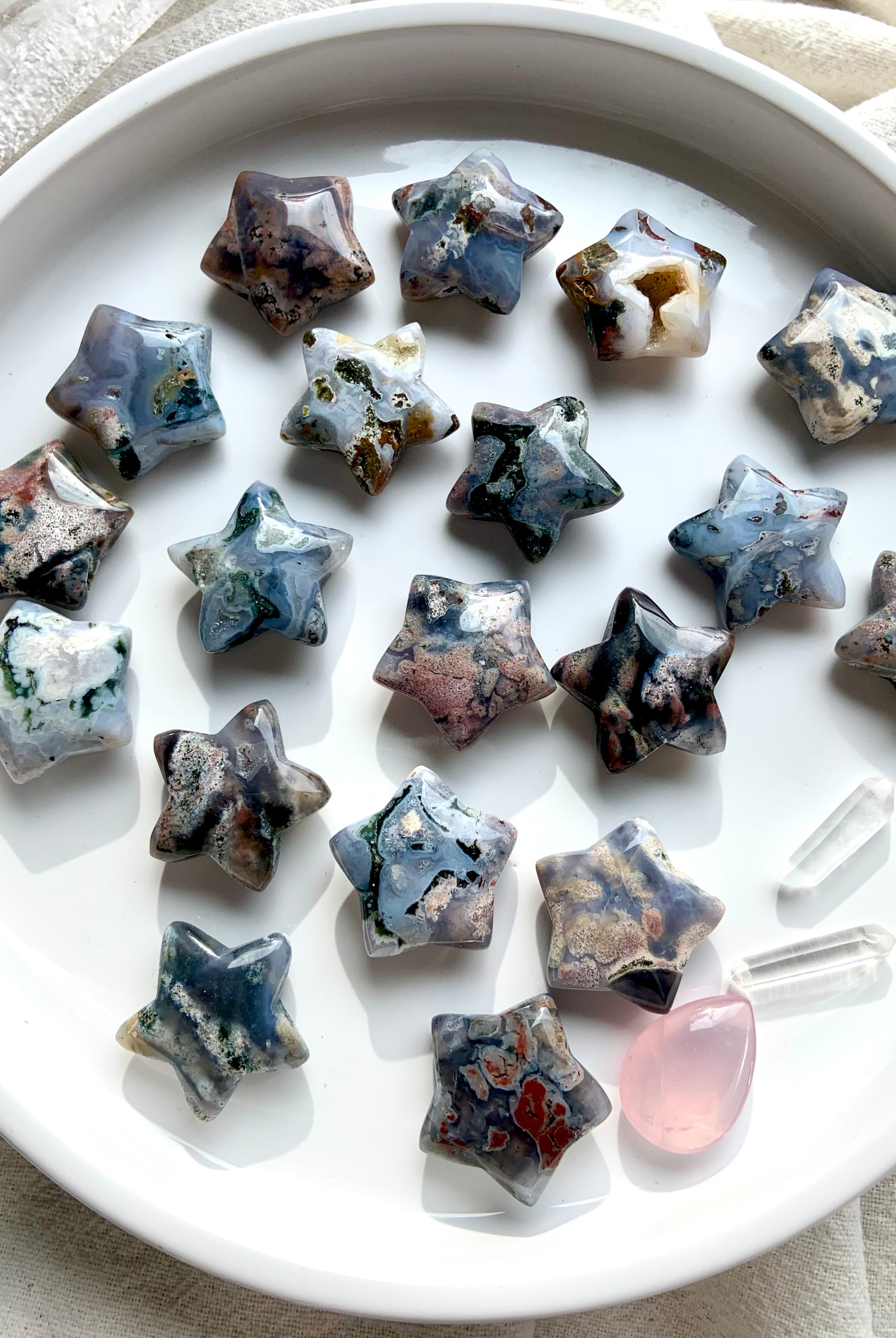 Cosmic Ocean Jasper stars on round plate with clear quartz points for altar décor