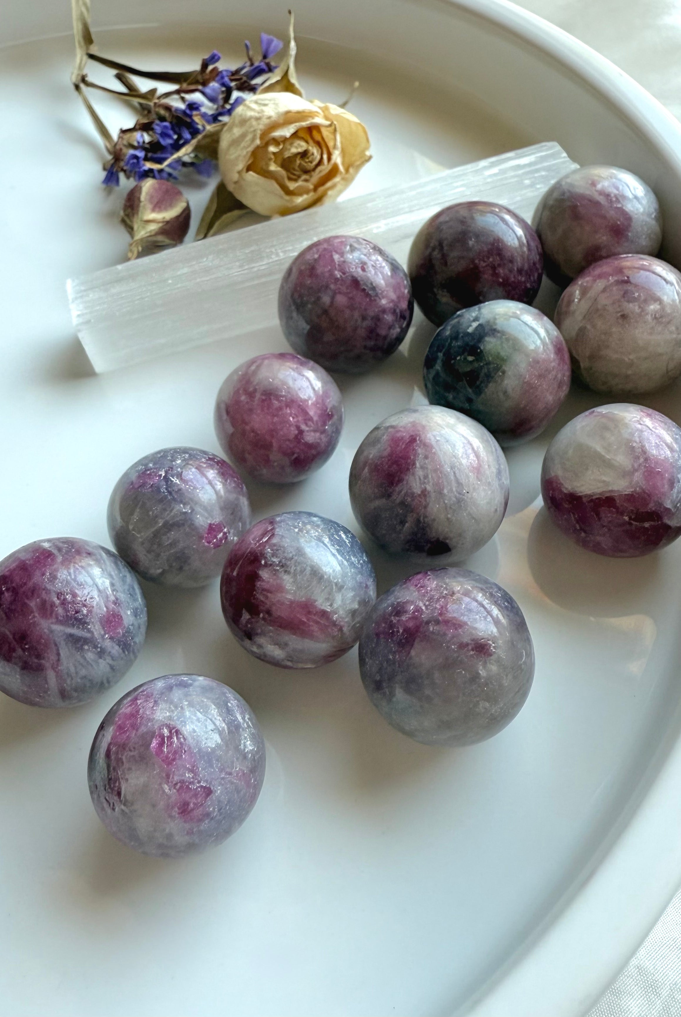 Cluster of Mini Unicorn Stone spheres with soft pastel colors for heart chakra healing energy
