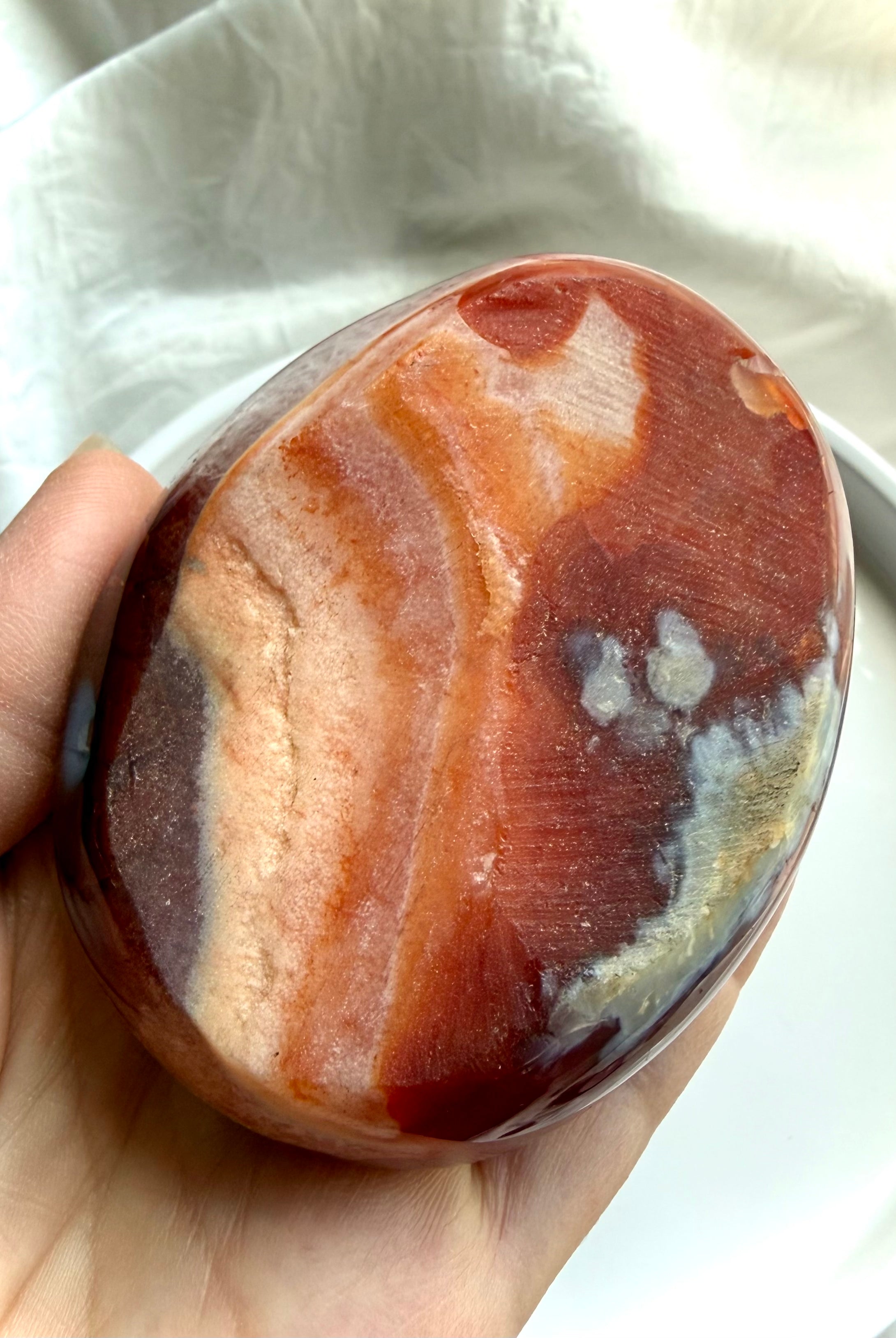 bottom view of carnelian and quartz crystal bowl with natural red and orange agate banding