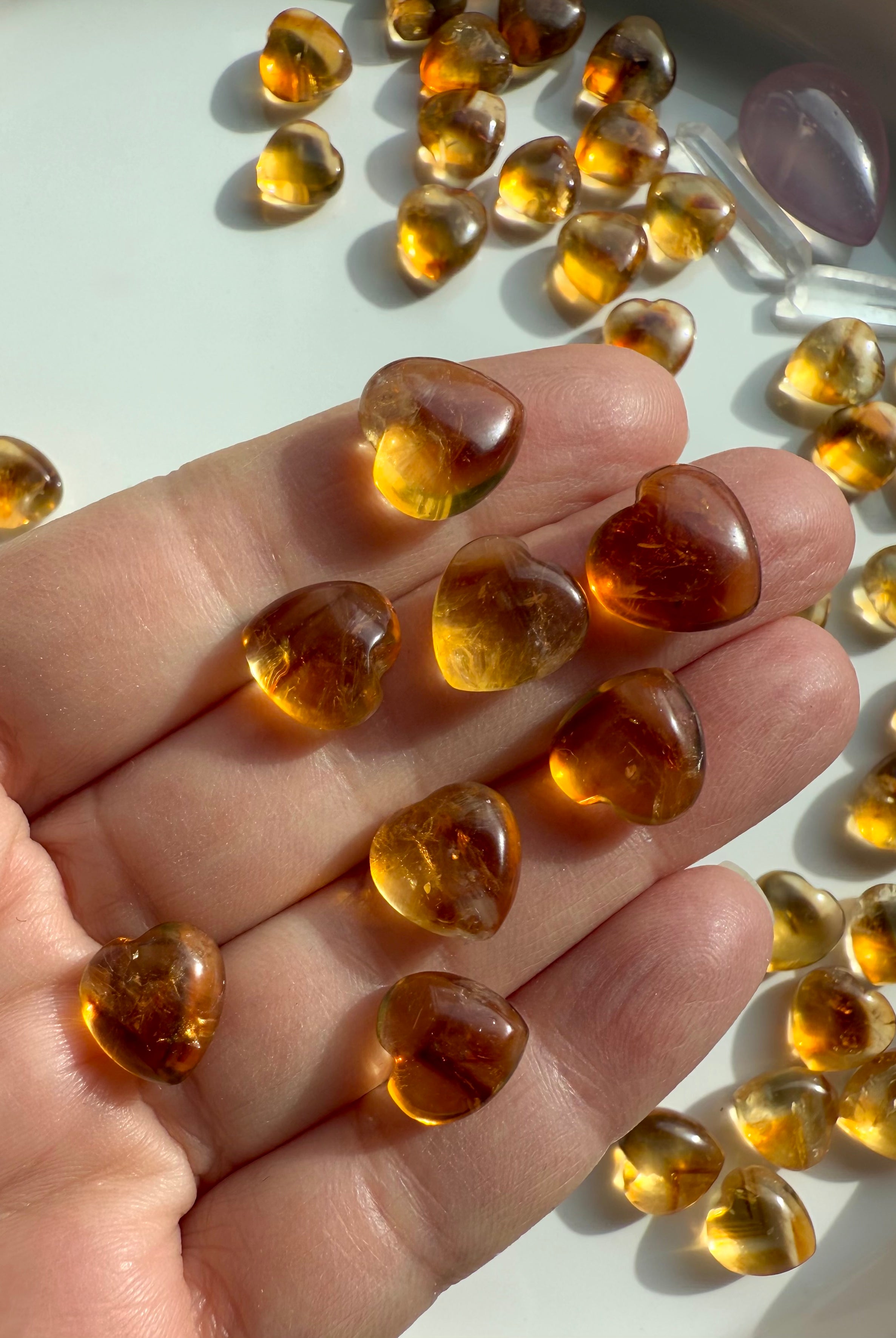 Mini Citrine Hearts shown on my hand for scale
