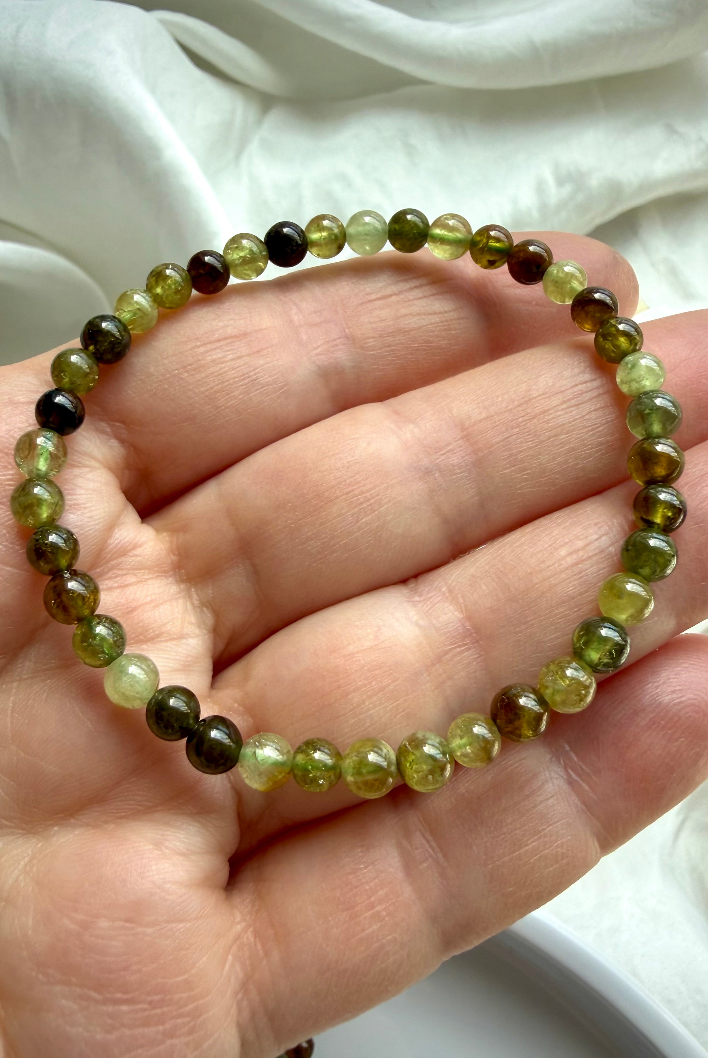 Natural Tsavorite Garnet bracelet with transparent green garnet gemstones and rich earthy color variation