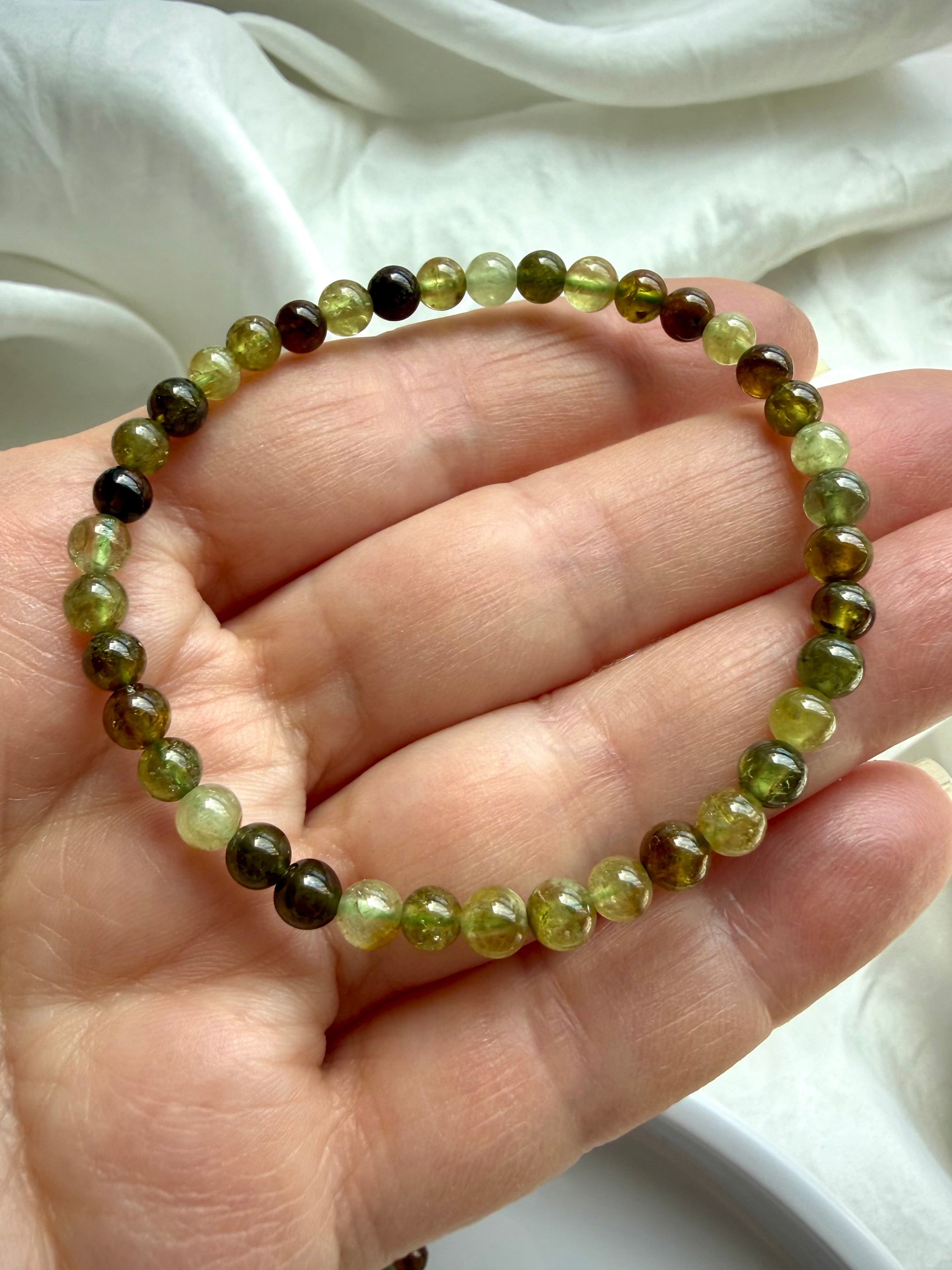 Natural Tsavorite Garnet bracelet with transparent green garnet gemstones and rich earthy color variation