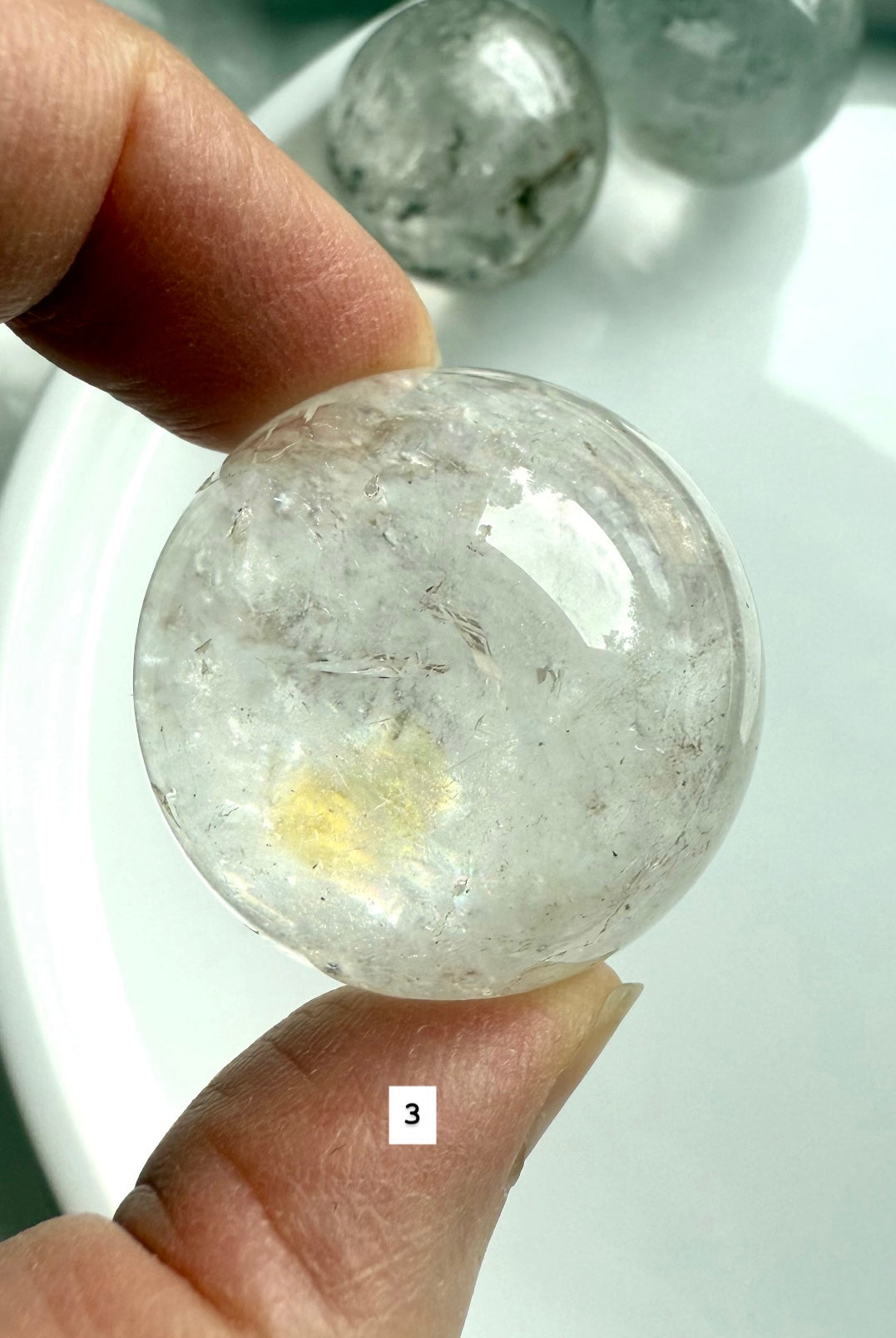 close up of a garden quartz sphere – mineral-filled lodolite for spiritual focus and grounding