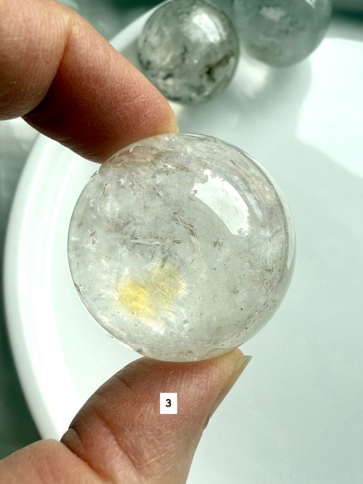 close up of a garden quartz sphere – mineral-filled lodolite for spiritual focus and grounding