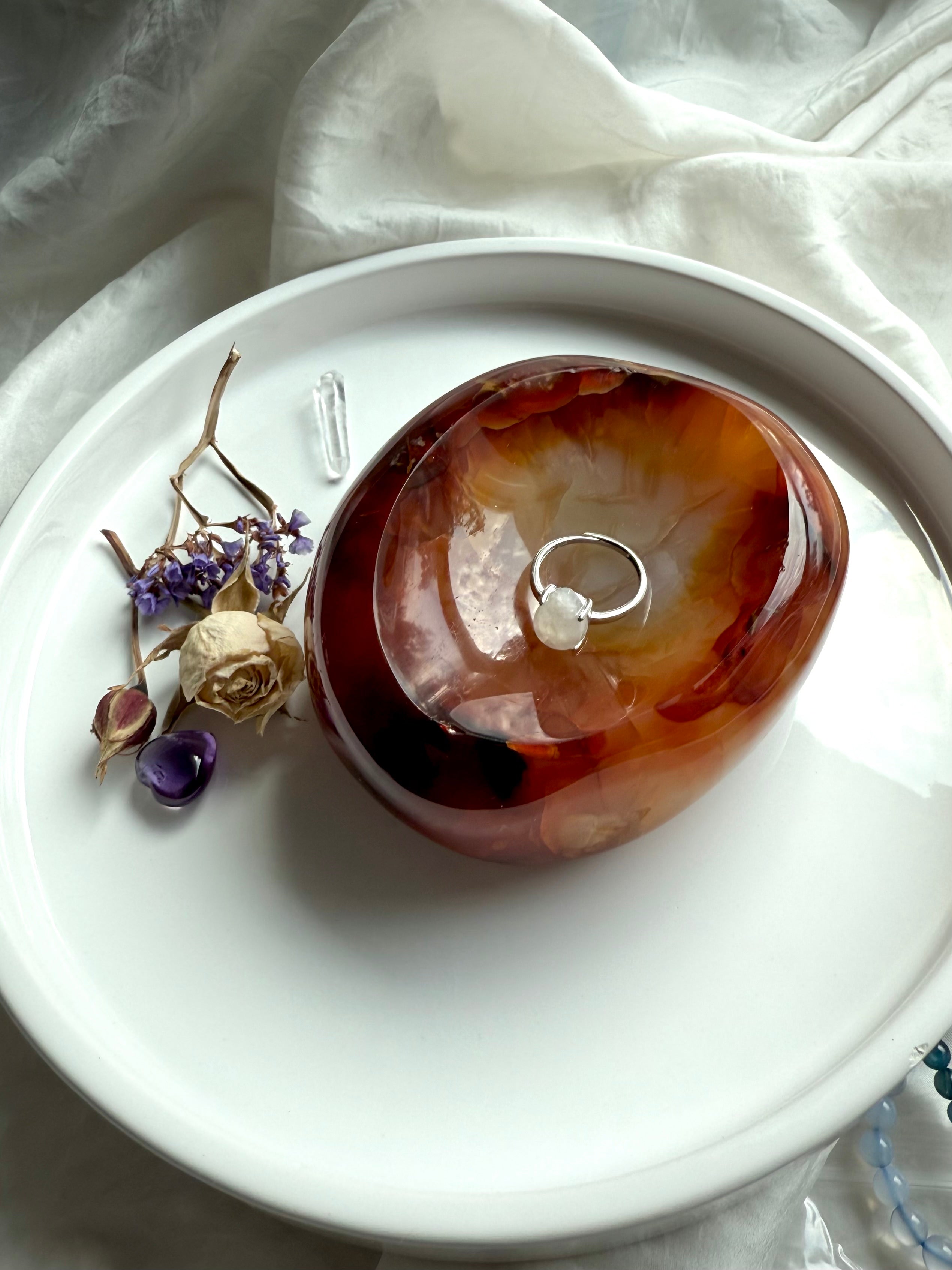 Carnelian gemstone bowl used as a jewelry dish – hand-carved crystal for altar rituals and sacred offerings