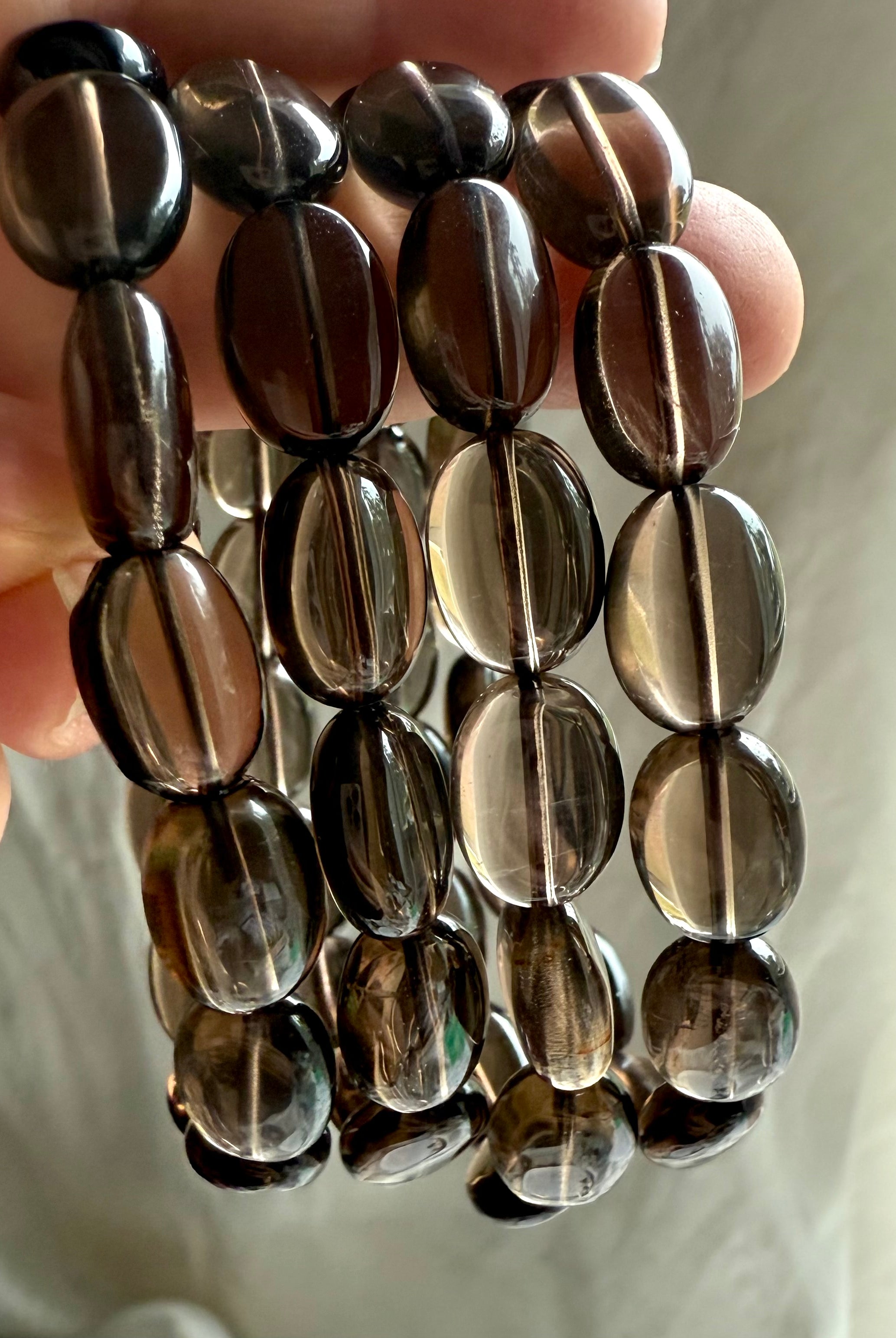 High-clarity Smoky Quartz bracelets – grounding crystal jewelry with polished flat oval beads