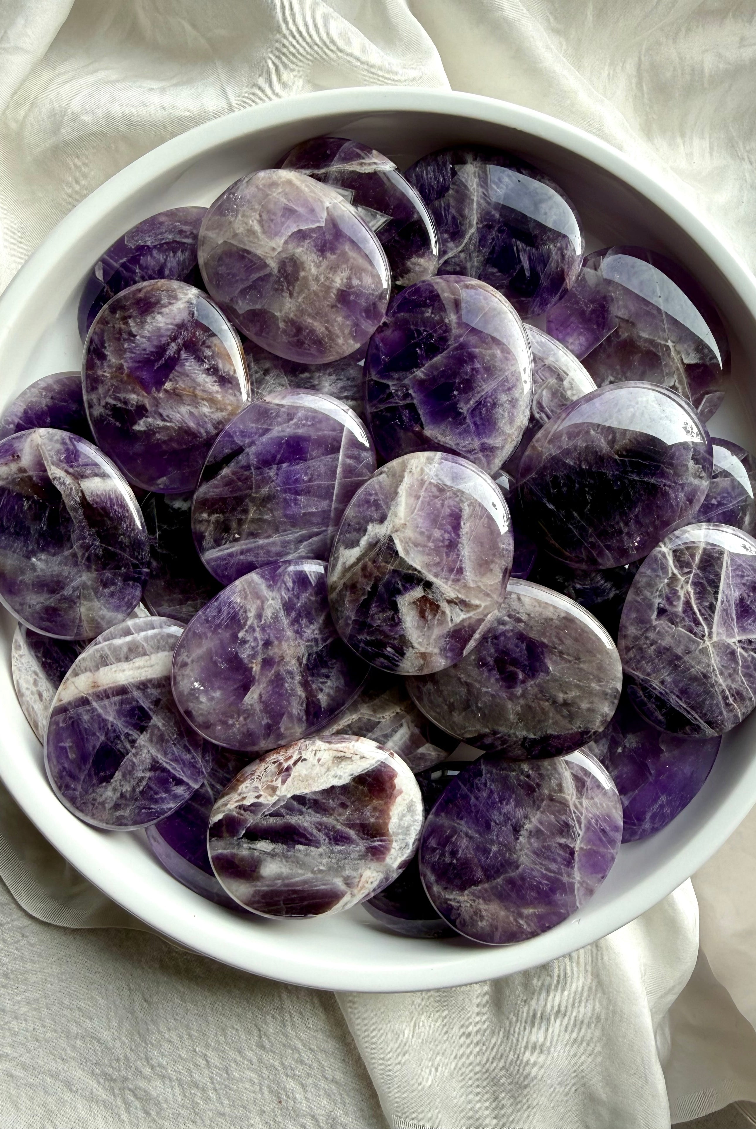 Dream amethyst palm stone with soft purple and white mineral patterns, calming amethyst crystal for peace and emotional balance