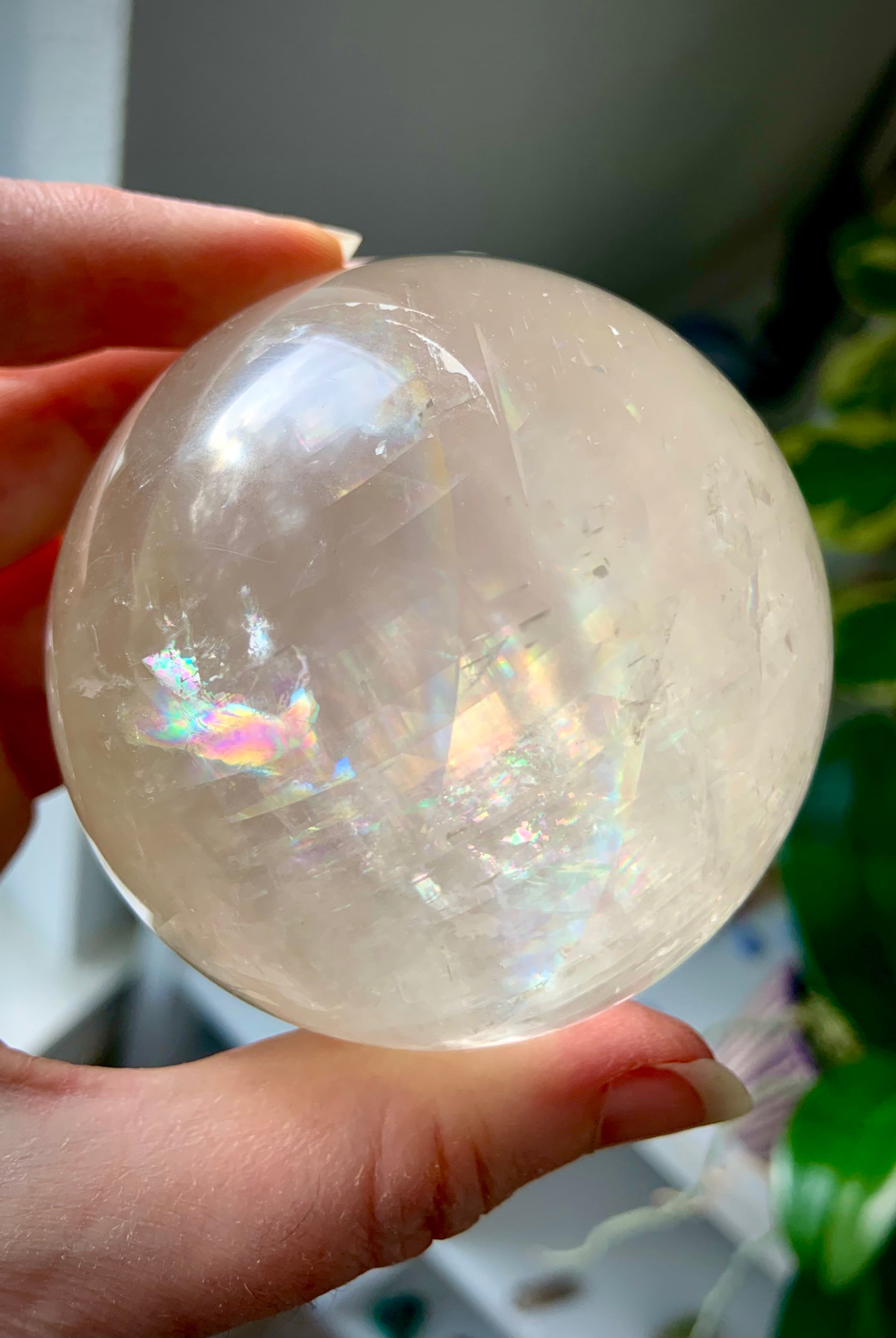 High quality Rainbow Honey Calcite Sphere comes with a wood stand