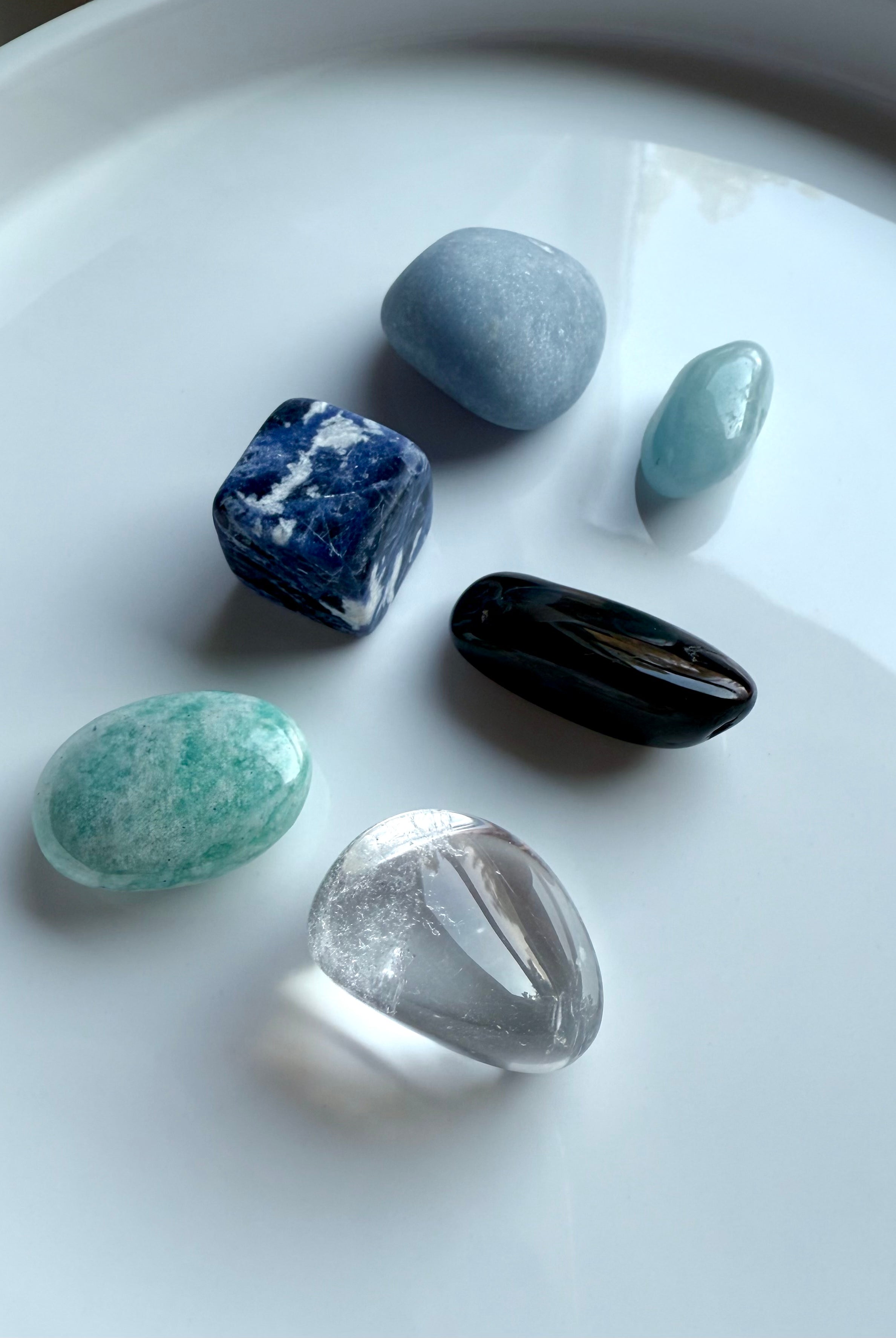 Group photo of Throat Chakra Crystal Set — Angelite, Sodalite, Amazonite, Aquamarine, Blue Tiger’s Eye, Clear Quartz