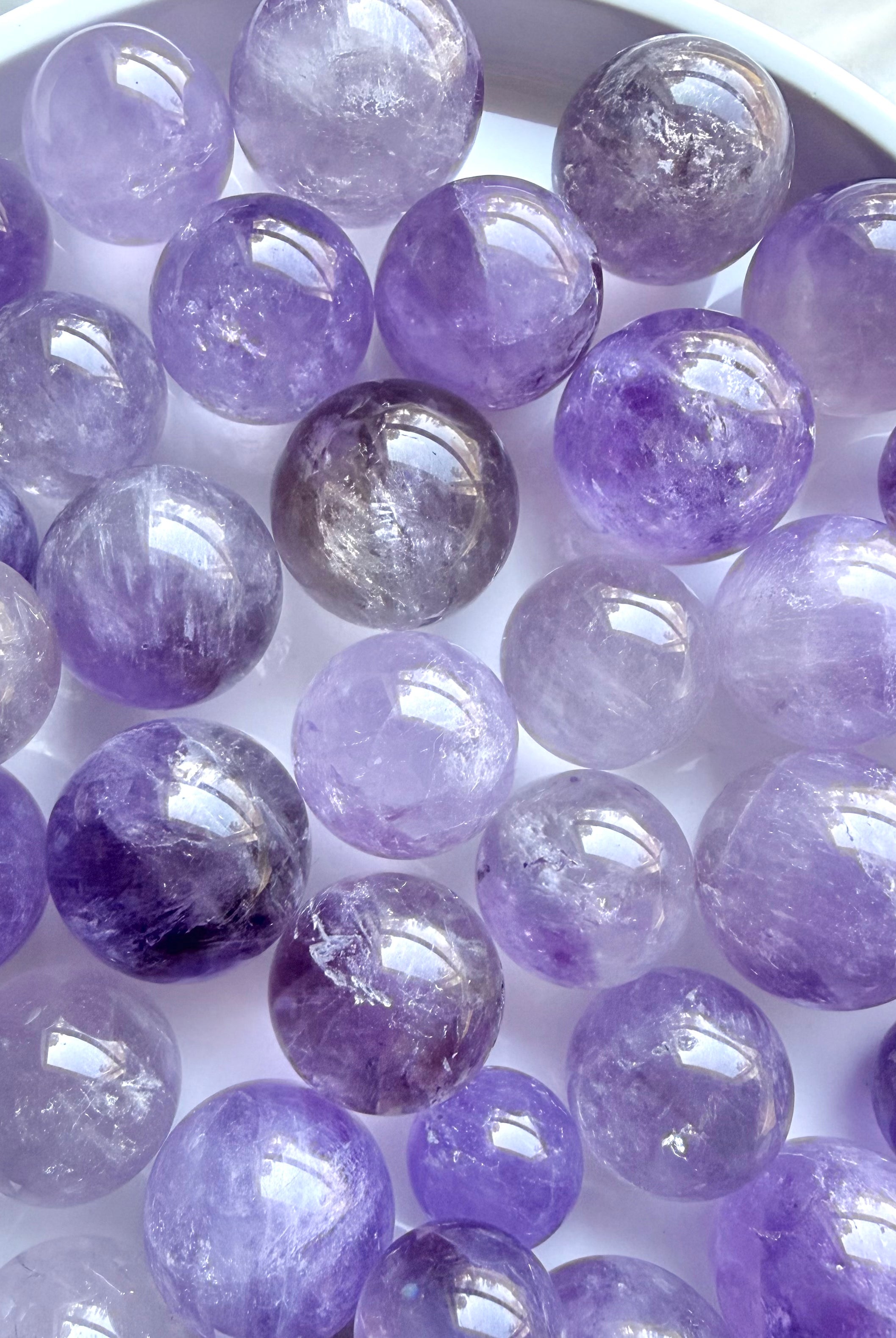 smoky amethyst mini spheres small crystal balls in lilac and purple tones polished gemstone spheres for meditation and decor