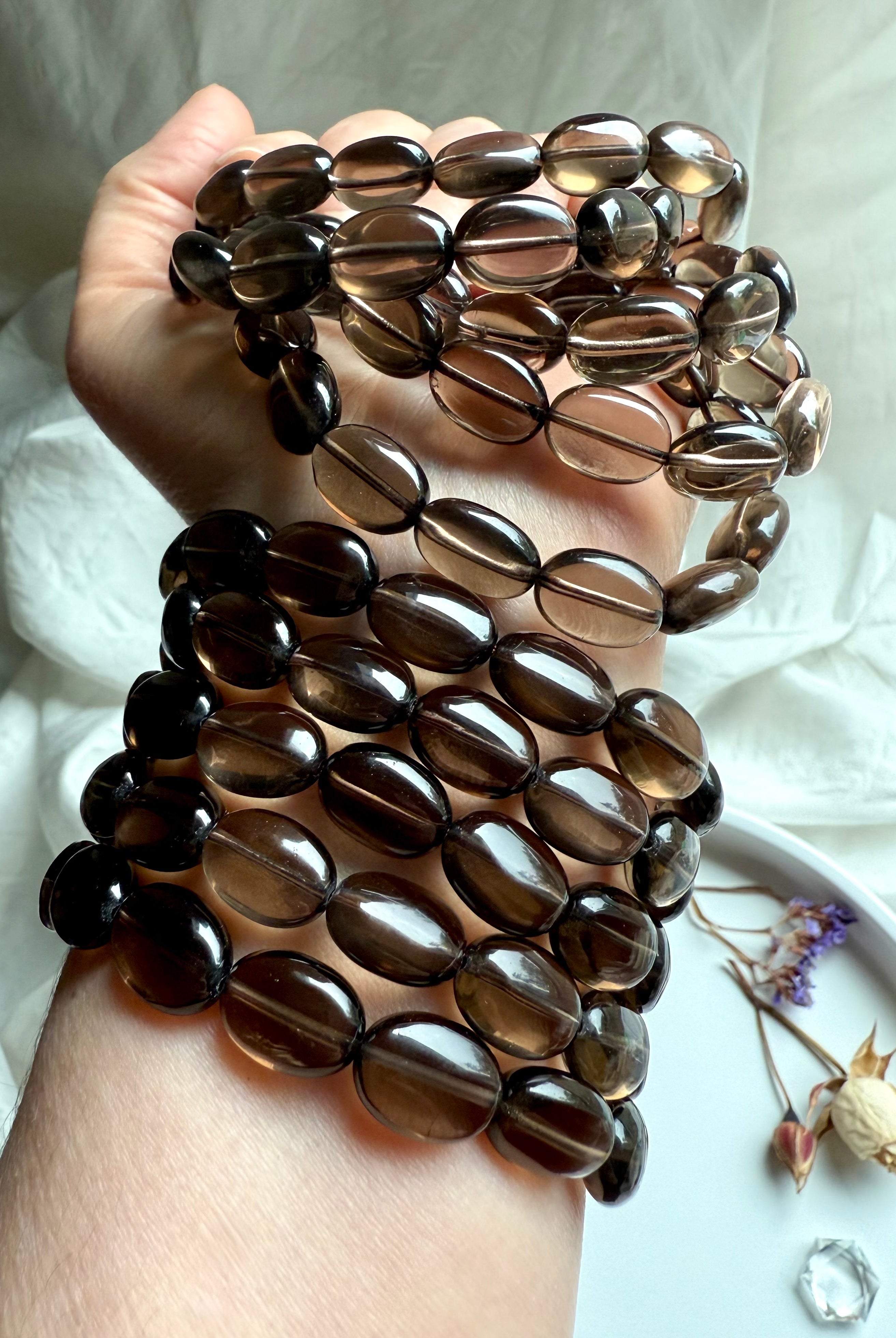 Polished Smoky Quartz oval bead bracelets stacked on wrist – crystal bracelets for protection and balance