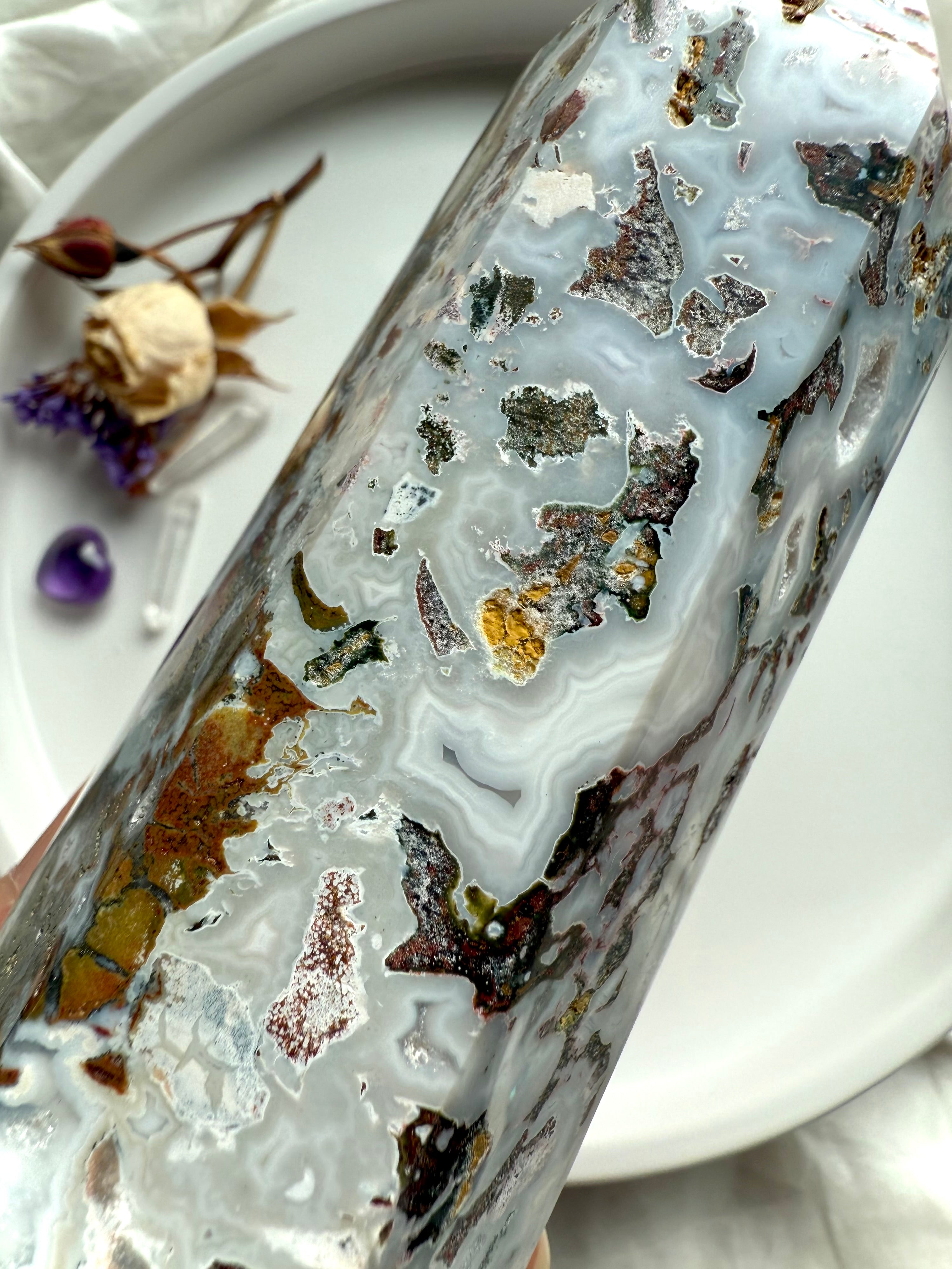 Close-up of Cosmic Ocean Jasper tower showing intricate chalcedony banding, earthy inclusions, and natural druzy pockets