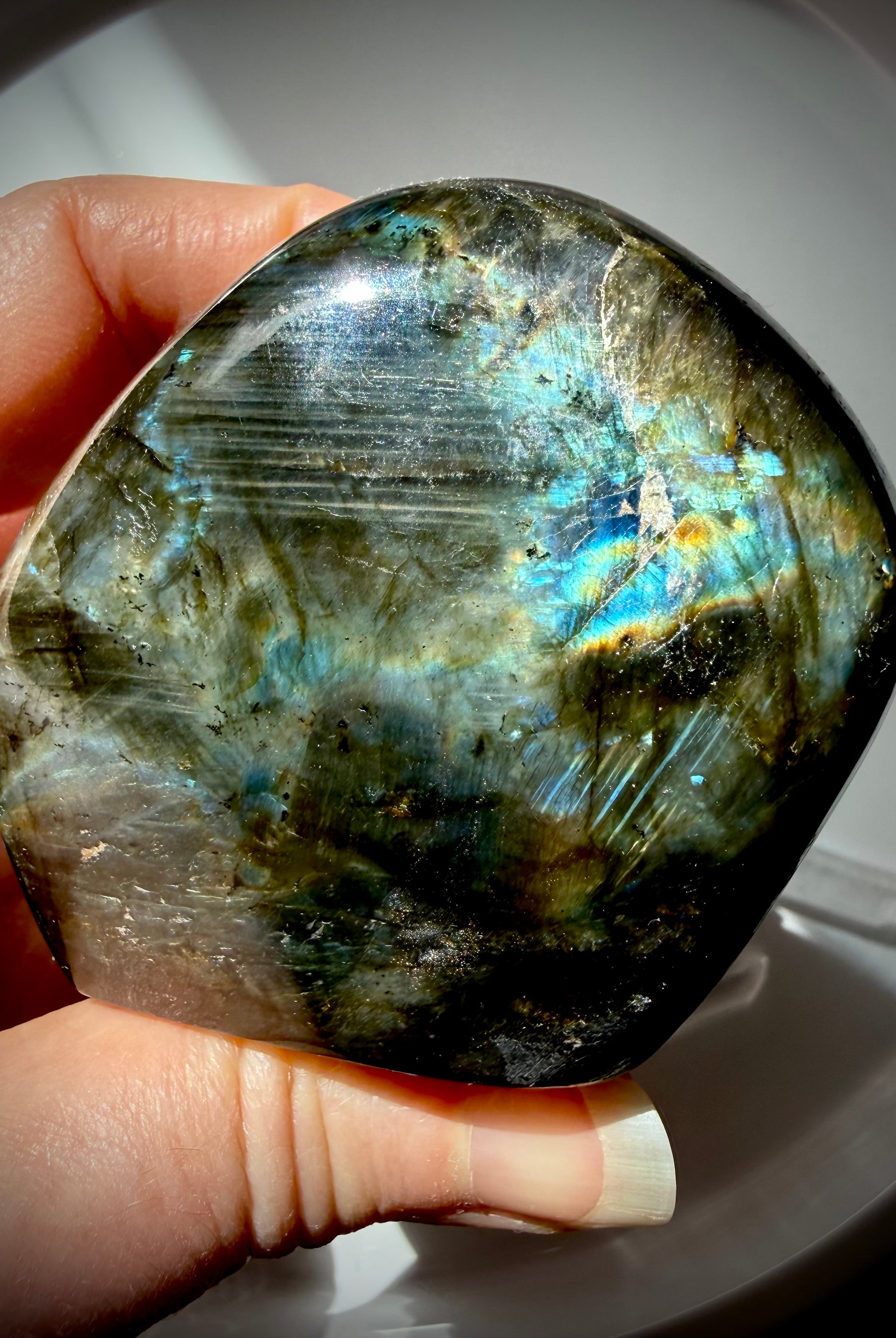Back of Rainbow Labradorite freeform showing natural gray-green matrix and subtle blue and gold flash
