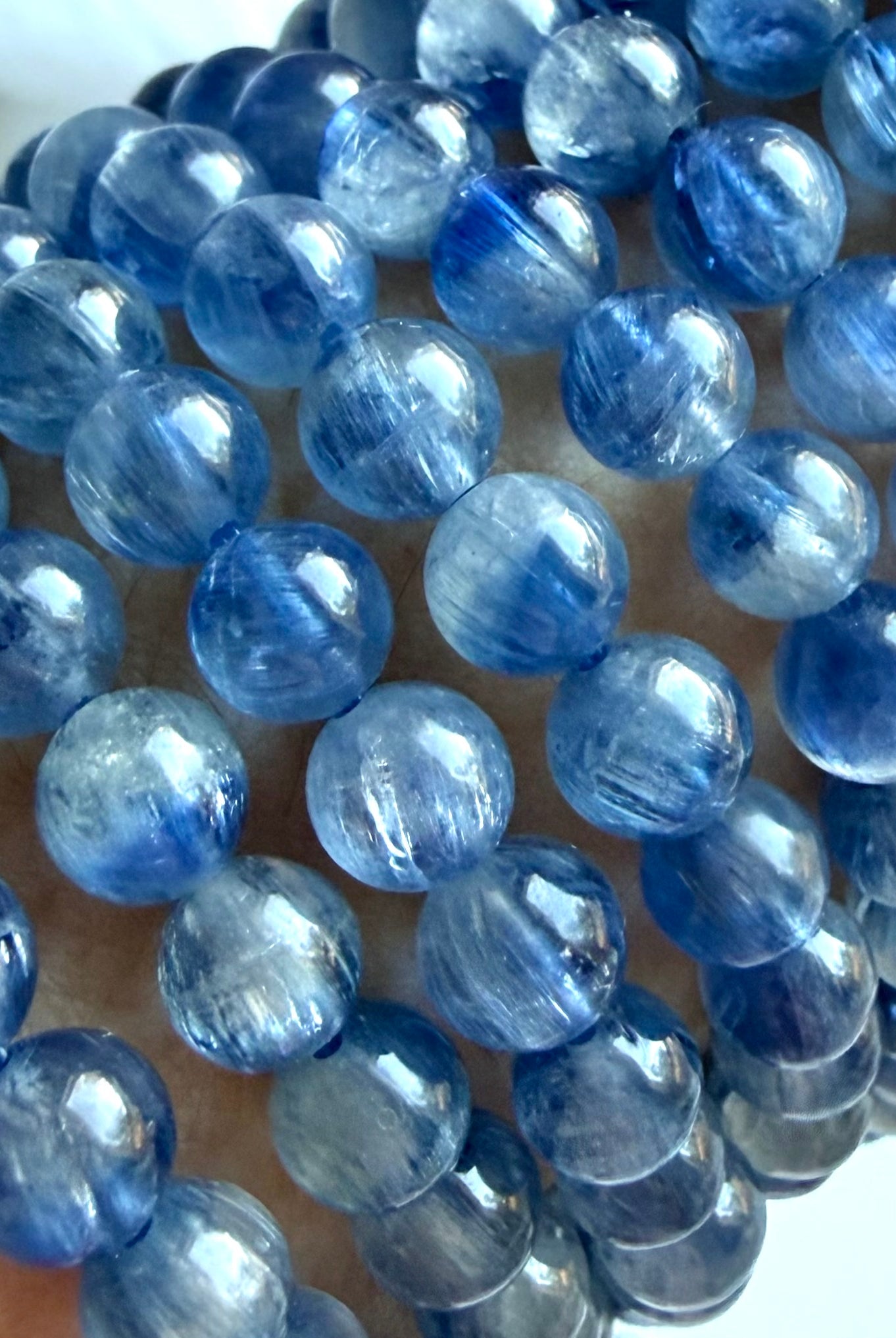 Close-up of Blue Kyanite crystal bracelet showing two-tone blue gemstones and silky crystalline depth
