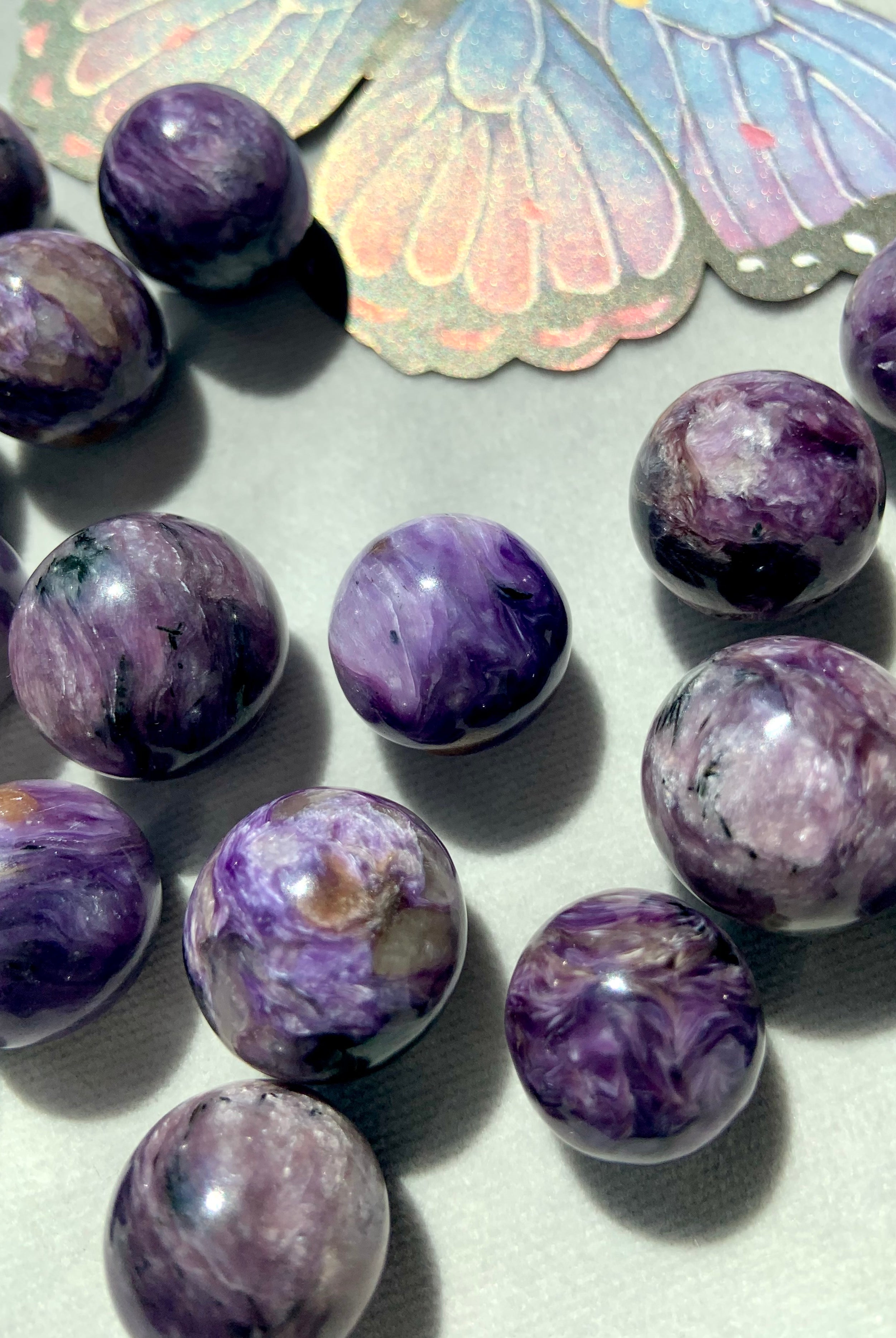 Charoite spheres with a lovely color range from pale lilac to saturated purple to deep purple