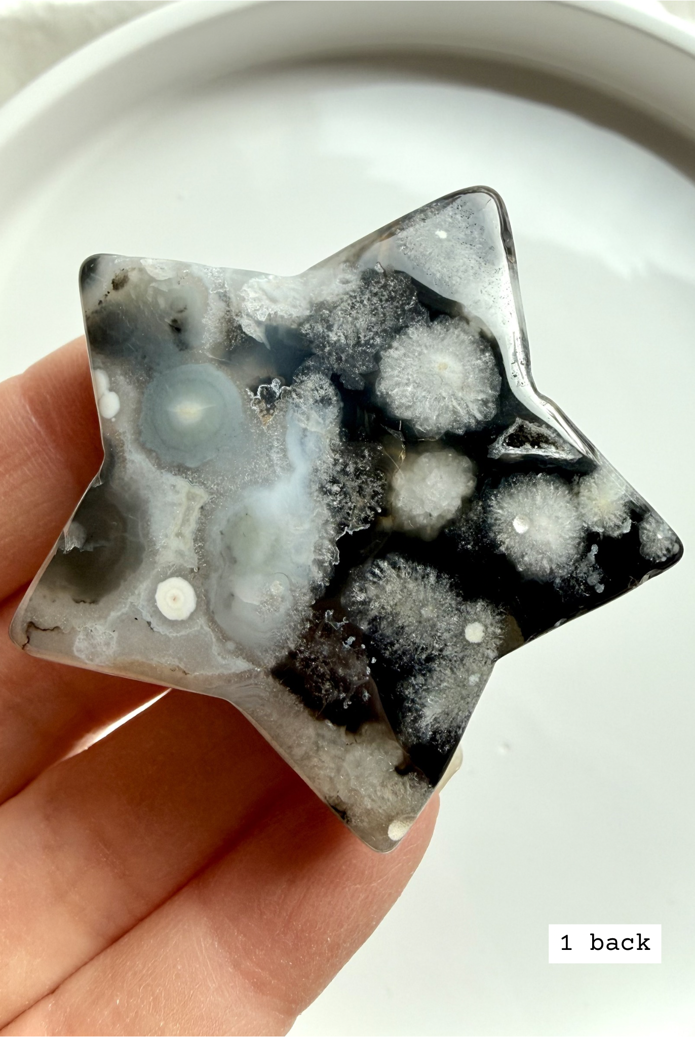 black flower agate star carving #1 back showing natural agate variation and soft bloom inclusions