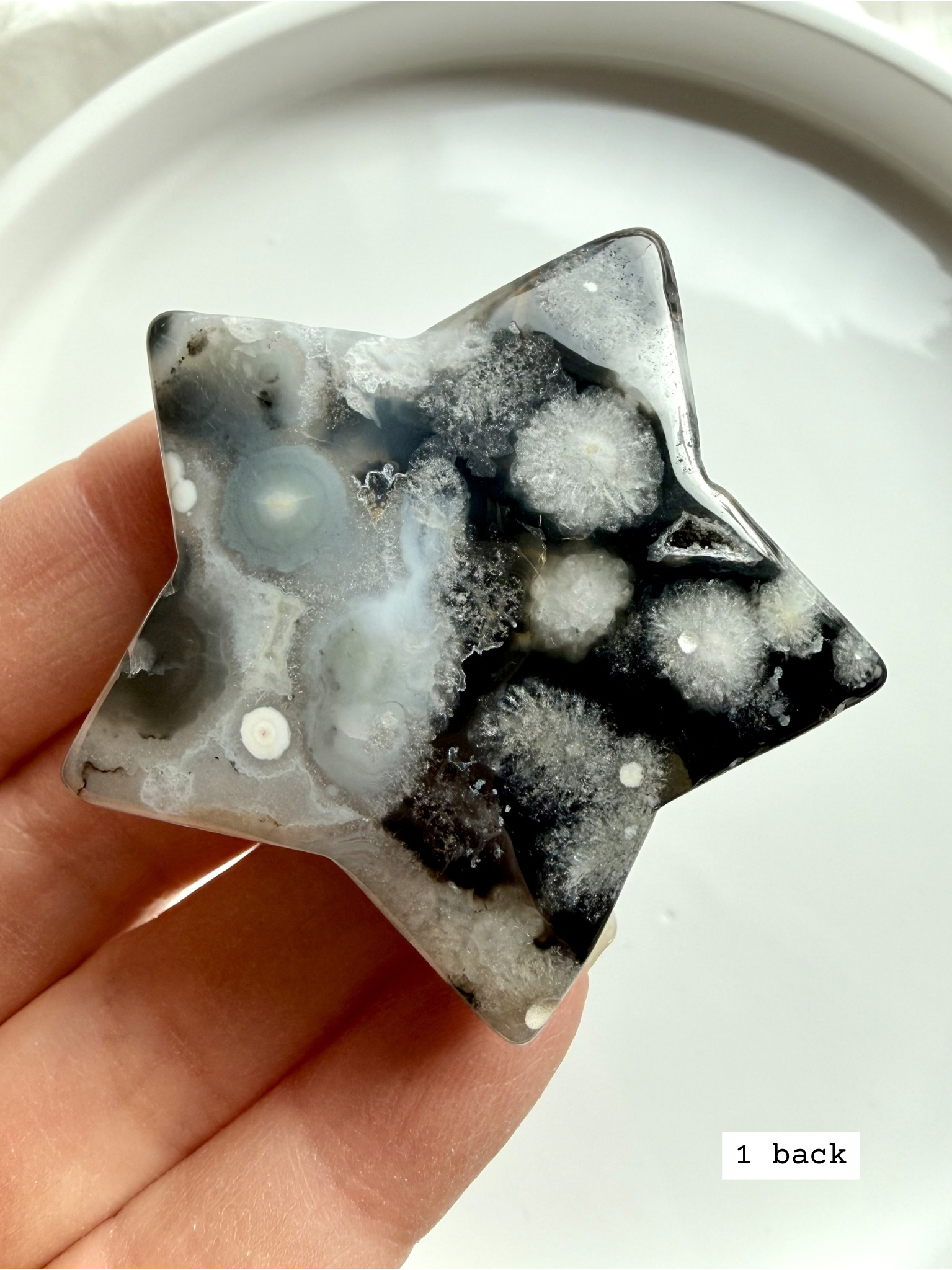 black flower agate star carving #1 back showing natural agate variation and soft bloom inclusions