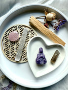 Lepidolite Quan Yin carving with rose quartz, smoky quartz, palo santo, selenite + dried flowers in heart dish on altar tray – crystal gift set for peace and spiritual healing
