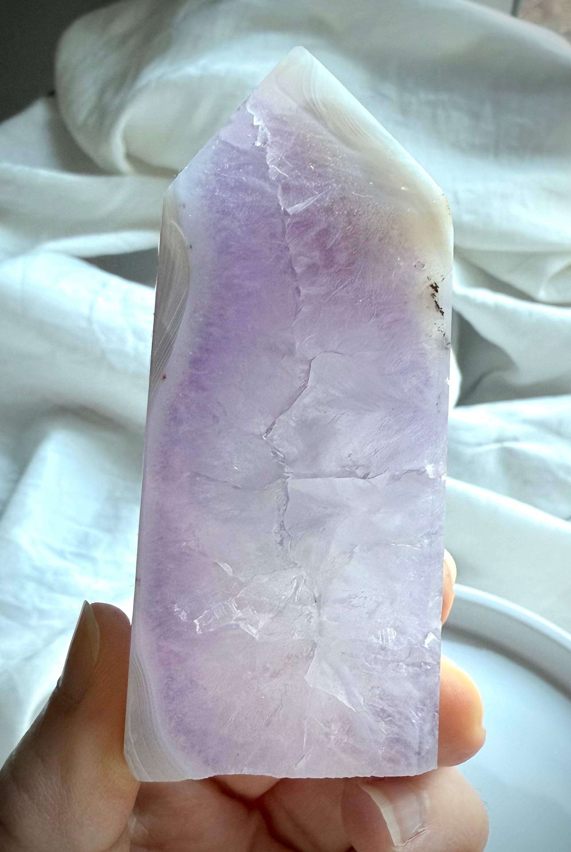Back view of Amethyst Geode Tower revealing purple crystal structure and soft banding