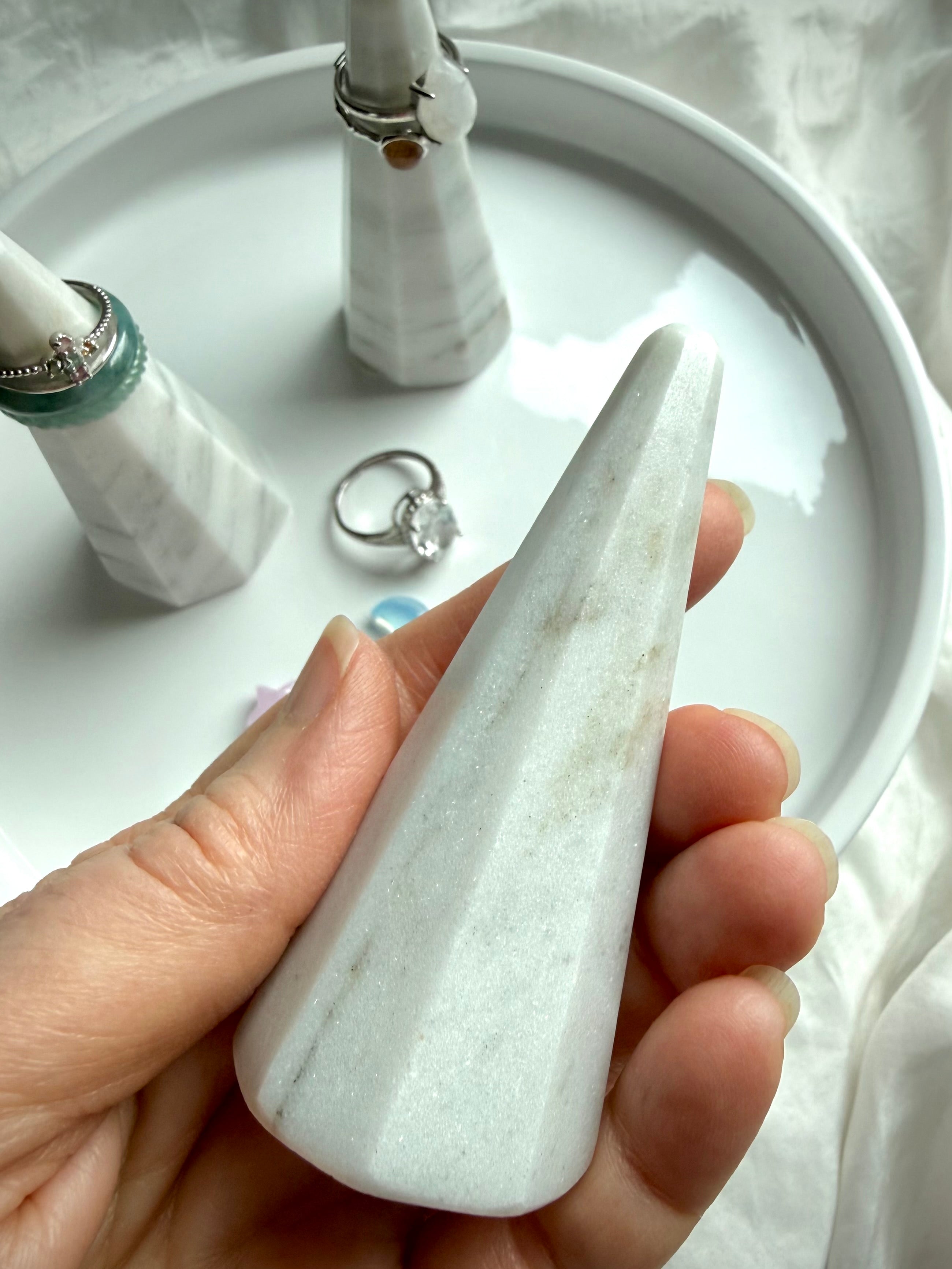 Marble jewelry cone stand in hand showing scale and beveled edges