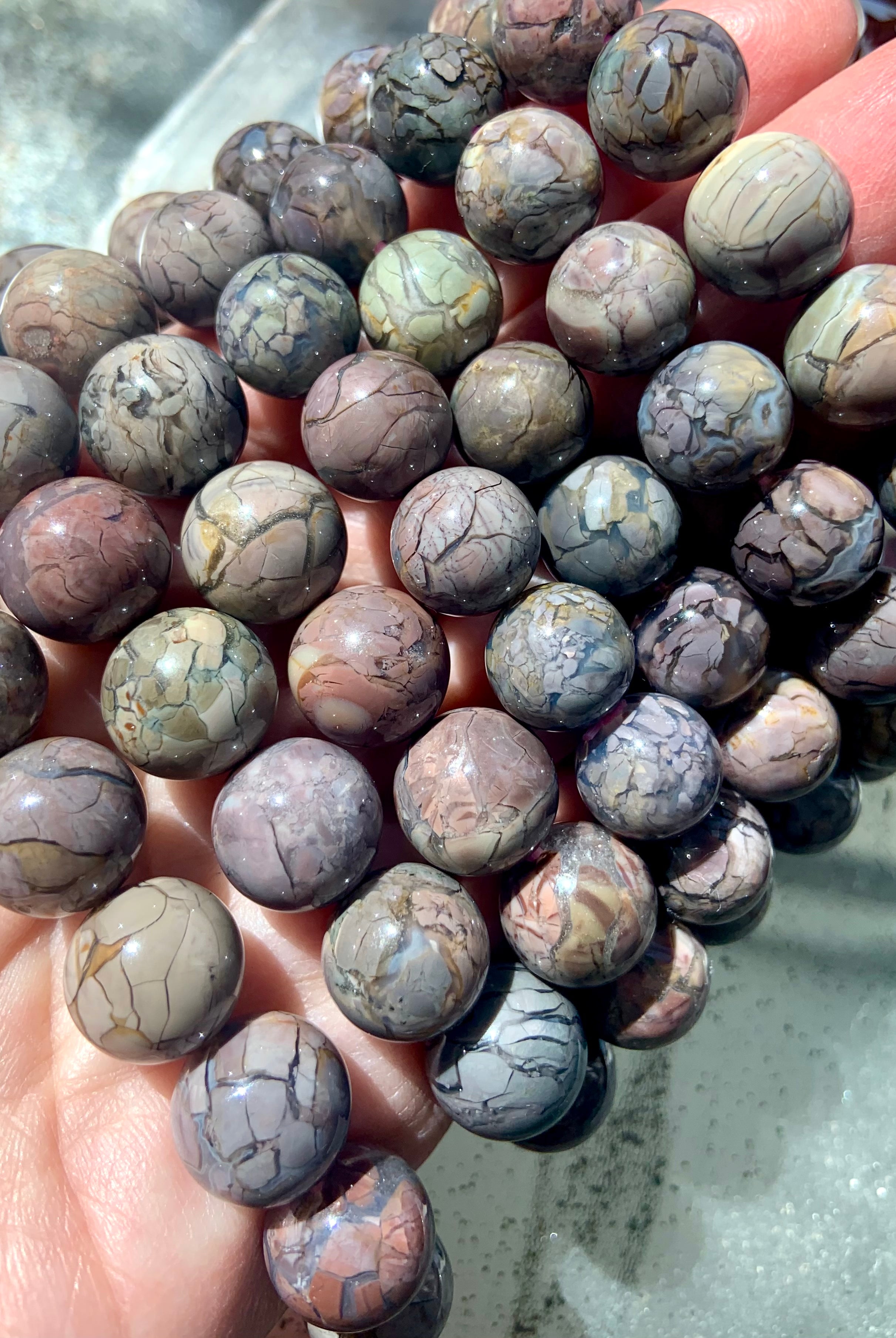 These Dragon Vein Alashan Agate Beaded Bracelets are a rare and coveted type of agate with natural snakeskin crackle patterns and dreamy pastel and earthy colors