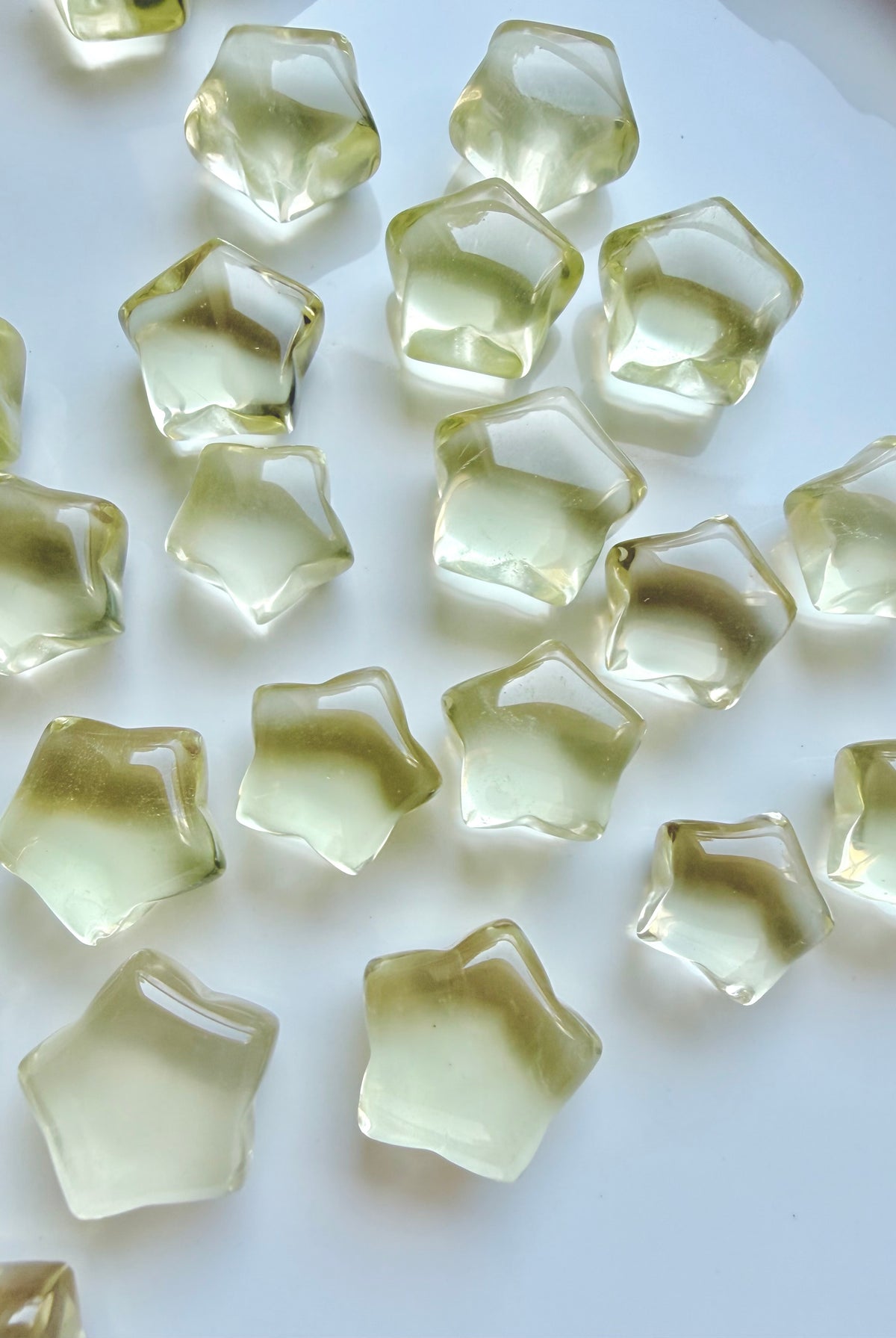 Mini Lemon Citrine stars in two sizes with clear lemon-yellow color and subtle natural crystalline patterns