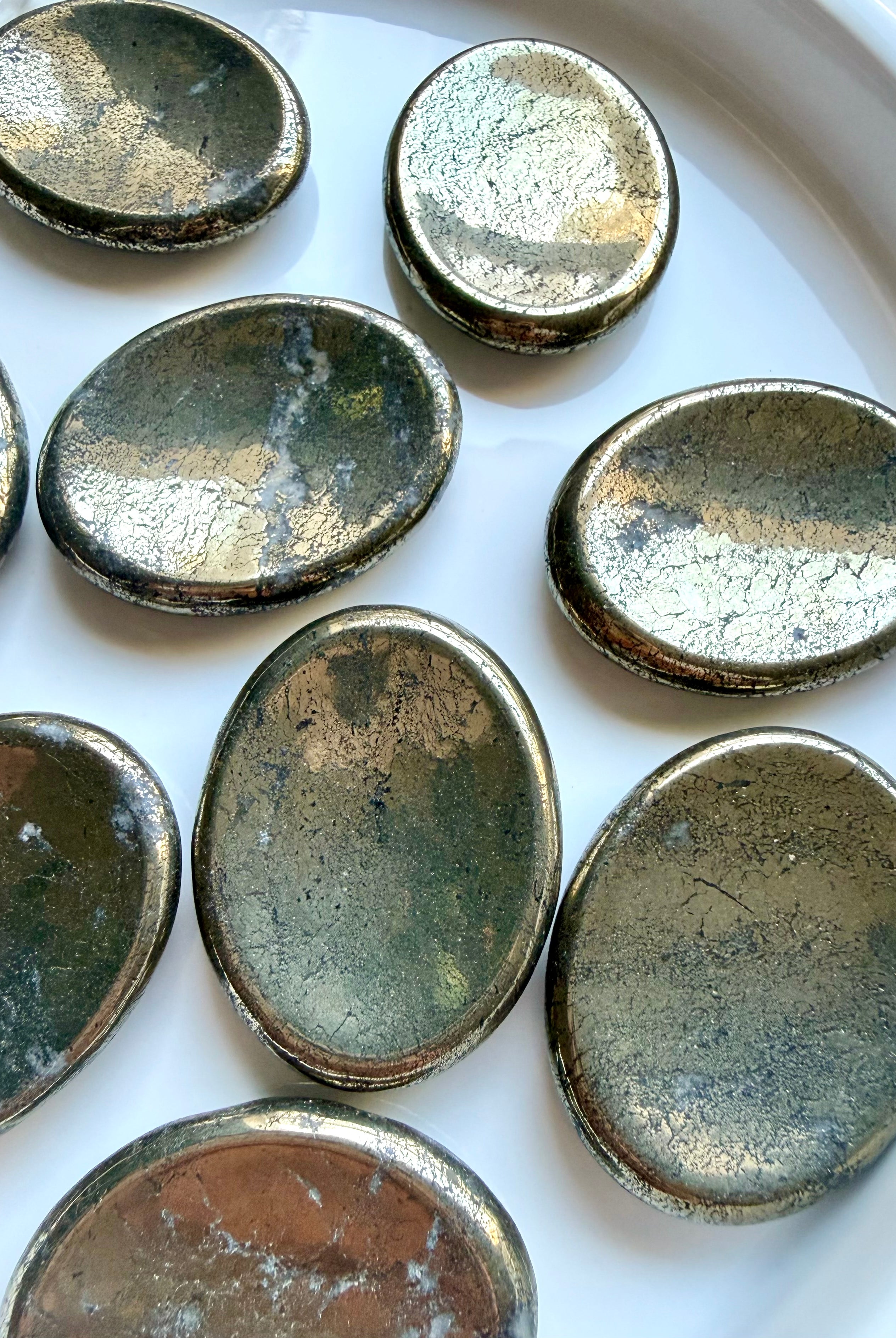 Natural Pyrite thumb stones with reflective metallic sheen and unique black and white mineral inclusions