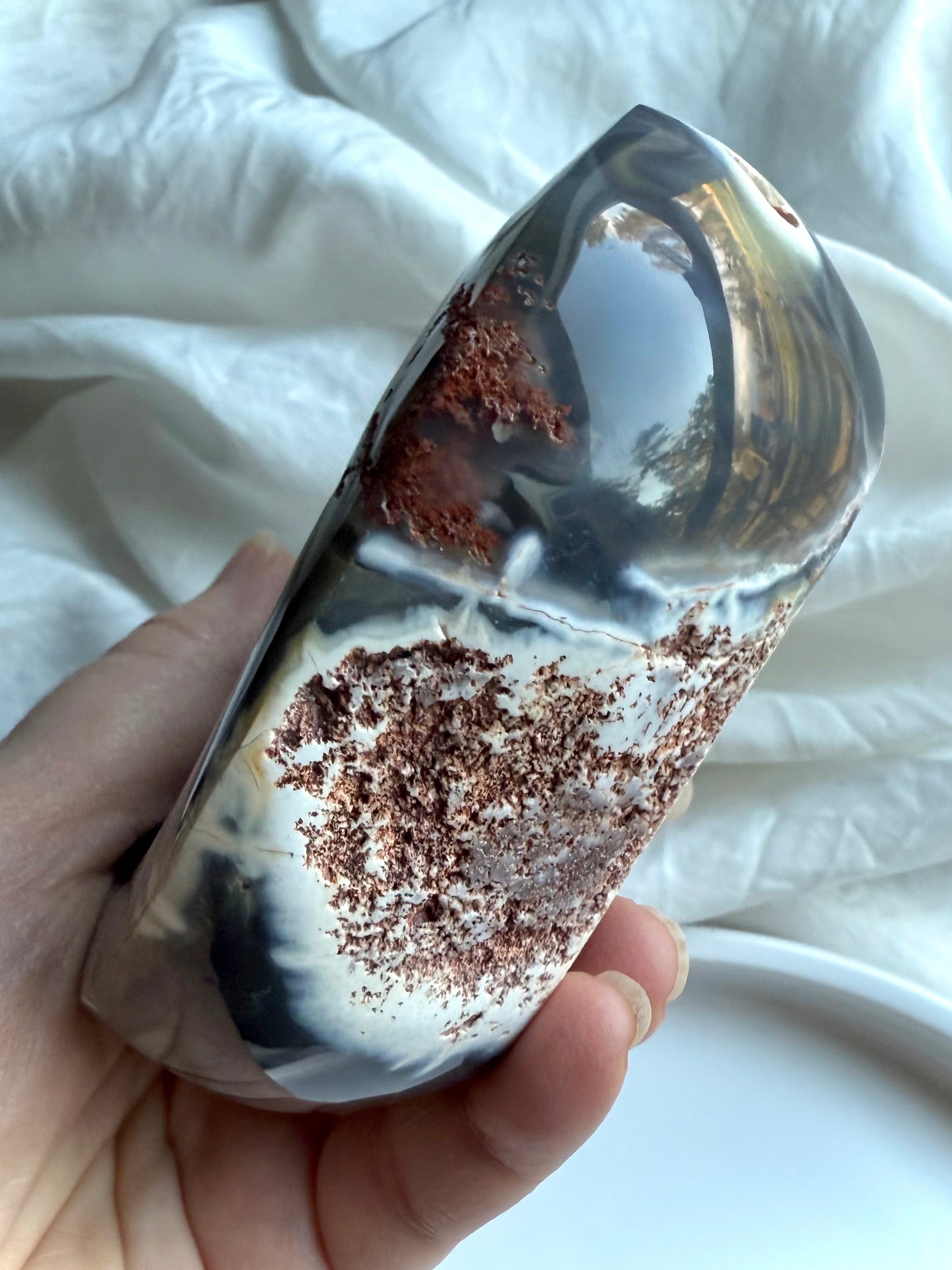 Side view of Orca Agate offering bowl with contrasting polished agate and raw matrix — unique carved crystal bowl for grounding, protection, and sacred rituals.