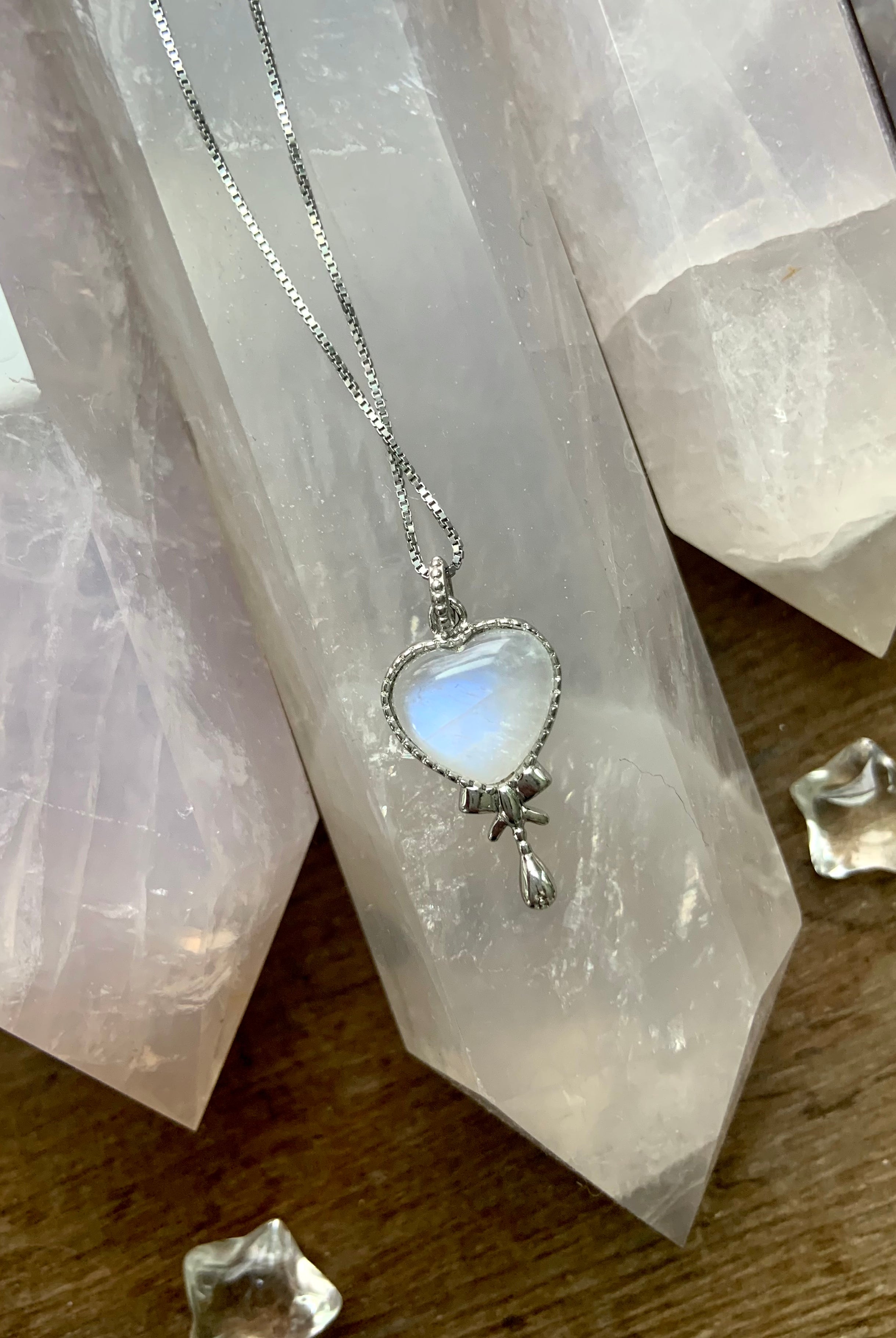 Sterling silver and moonstone crystal heart pendants for comfort and healing