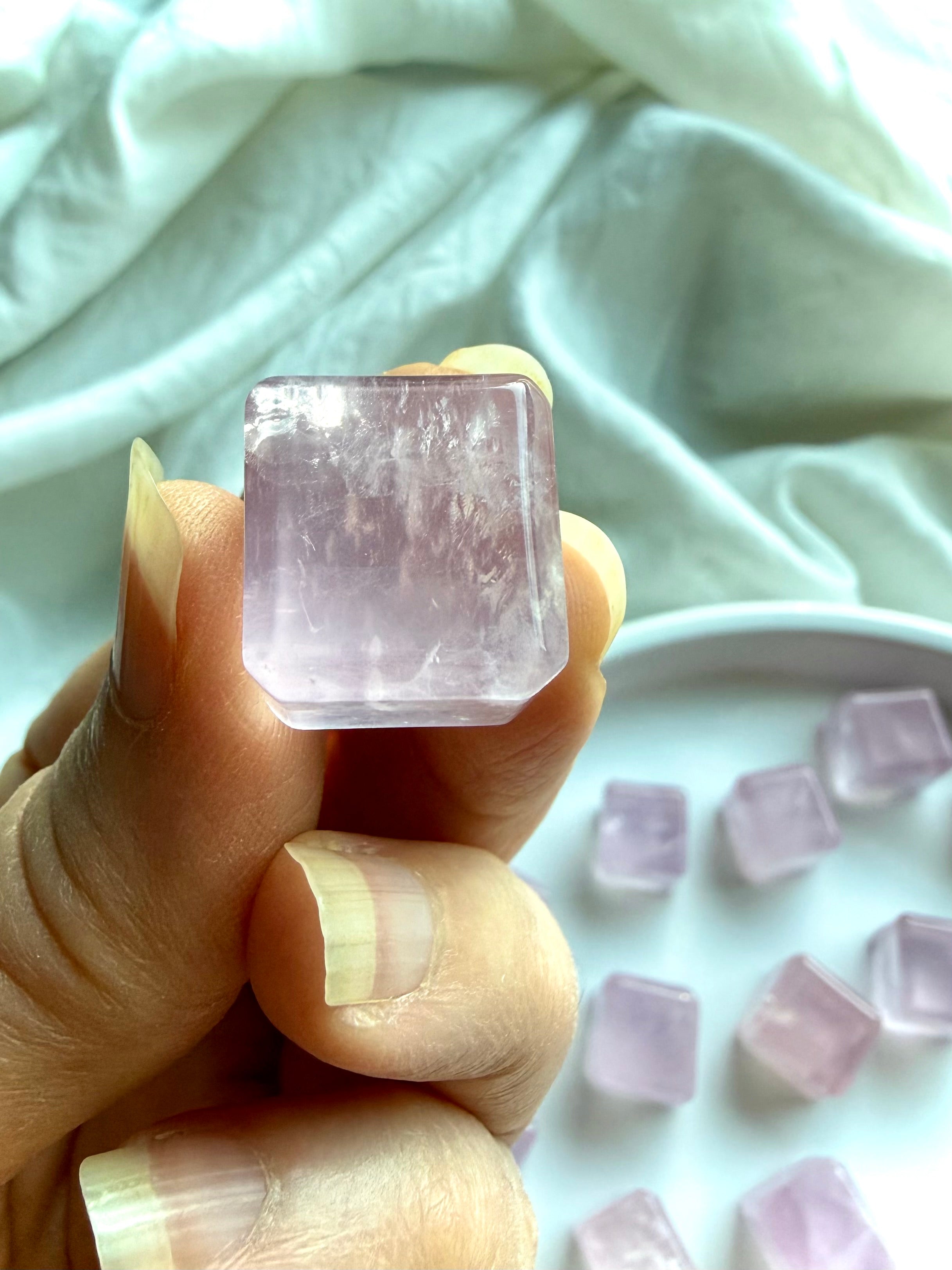 Rose quartz mini cube held in hand for scale, calming heart chakra crystal and pocket stone for love and balance