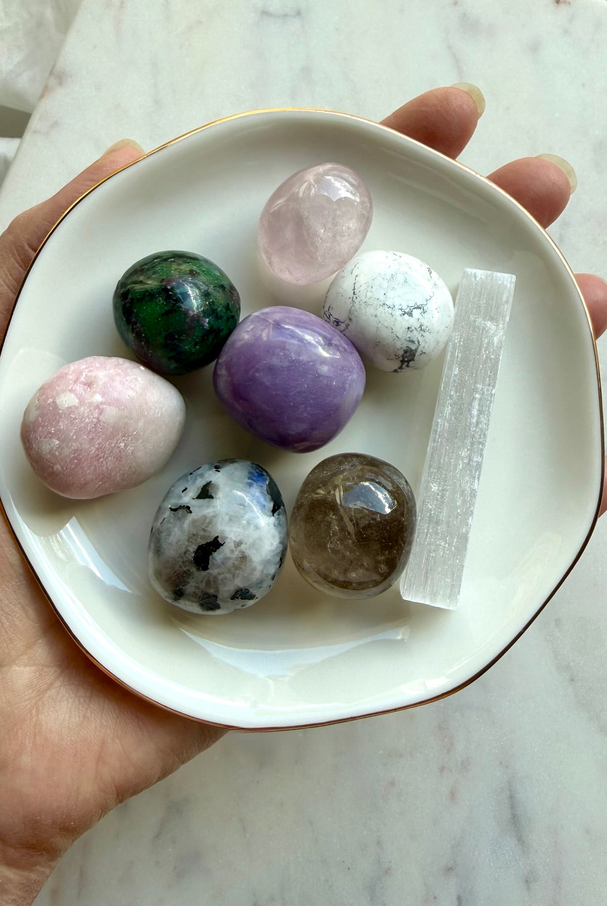 Grief support crystal set with Rose Quartz, Amethyst, Moonstone, Howlite, Smoky Quartz, and Selenite in a gold rim ceramic bowl