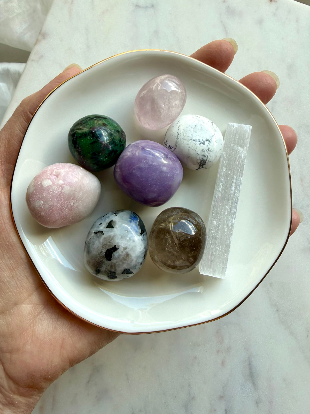 Grief support crystal set with Rose Quartz, Amethyst, Moonstone, Howlite, Smoky Quartz, and Selenite in a gold rim ceramic bowl