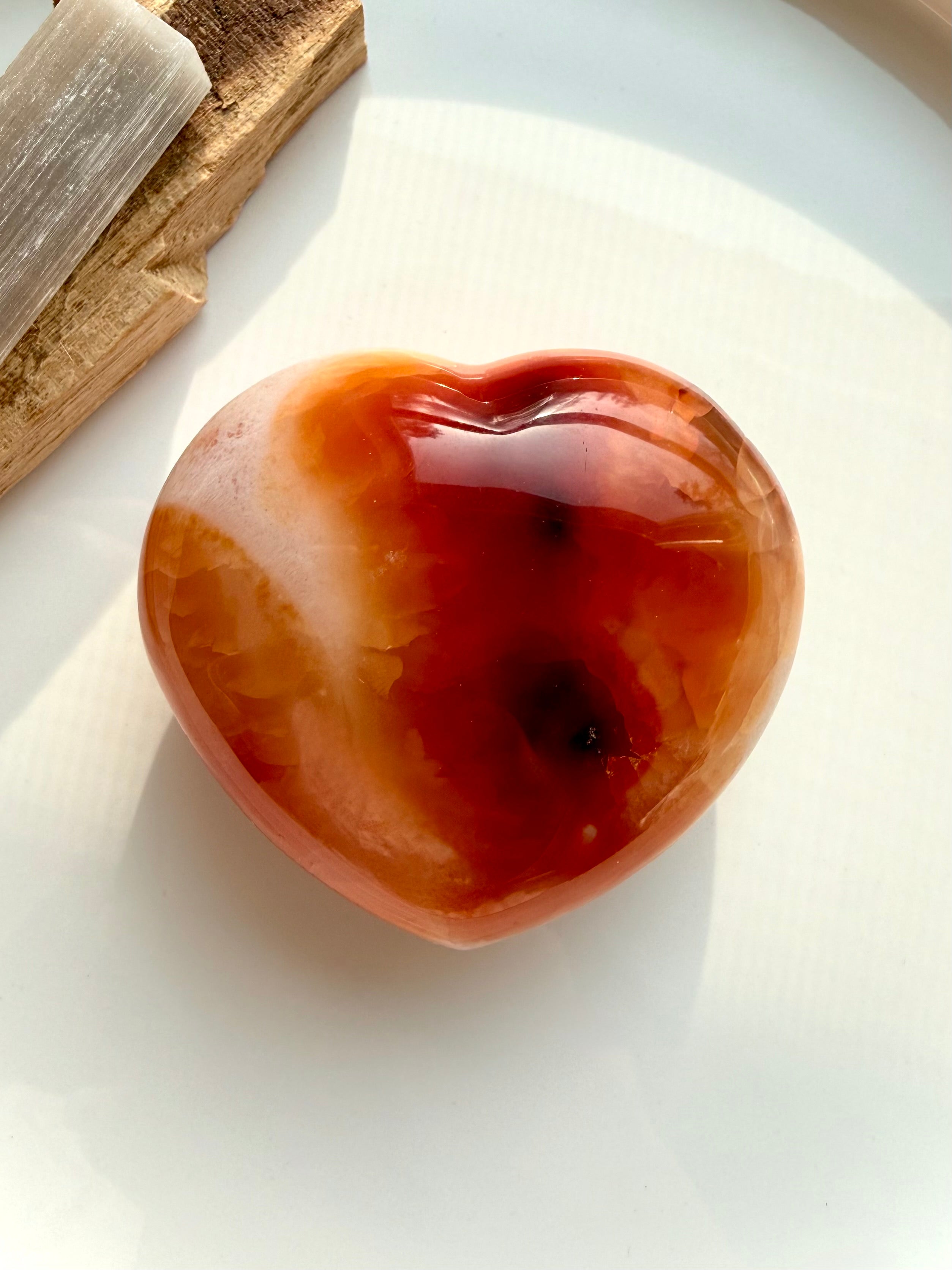 Carnelian heart crystal in fiery red and orange tones with natural patterning and glossy polish, one of a kind Sacral Chakra stone for creativity and confidence