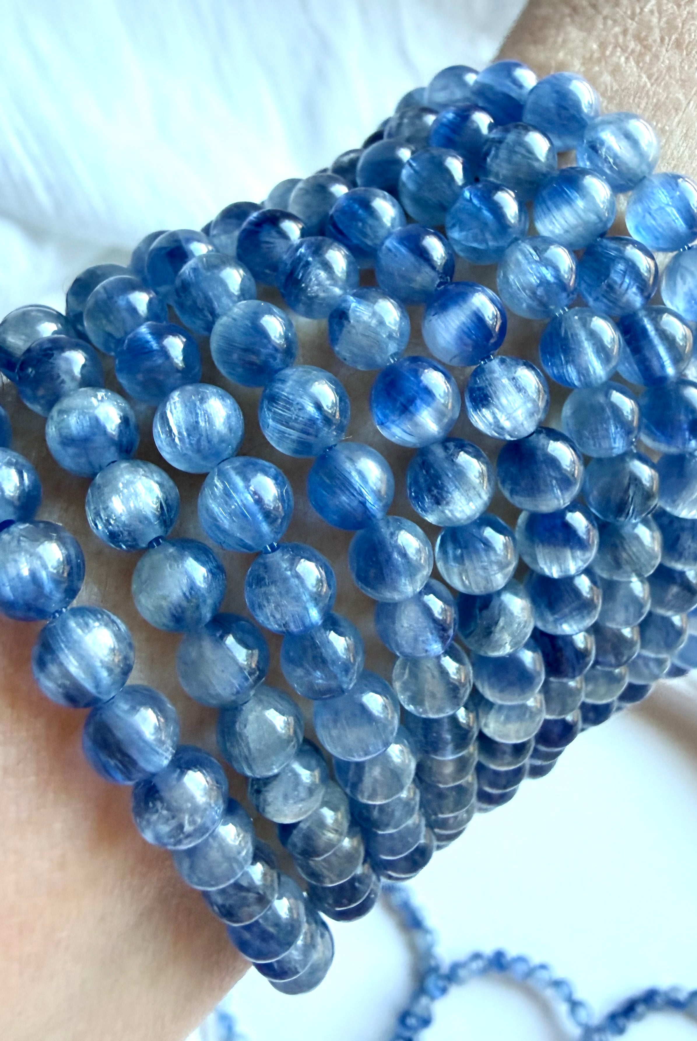 Collection of Blue Kyanite bracelets in layered shades of icy blue, cornflower, and sapphire
