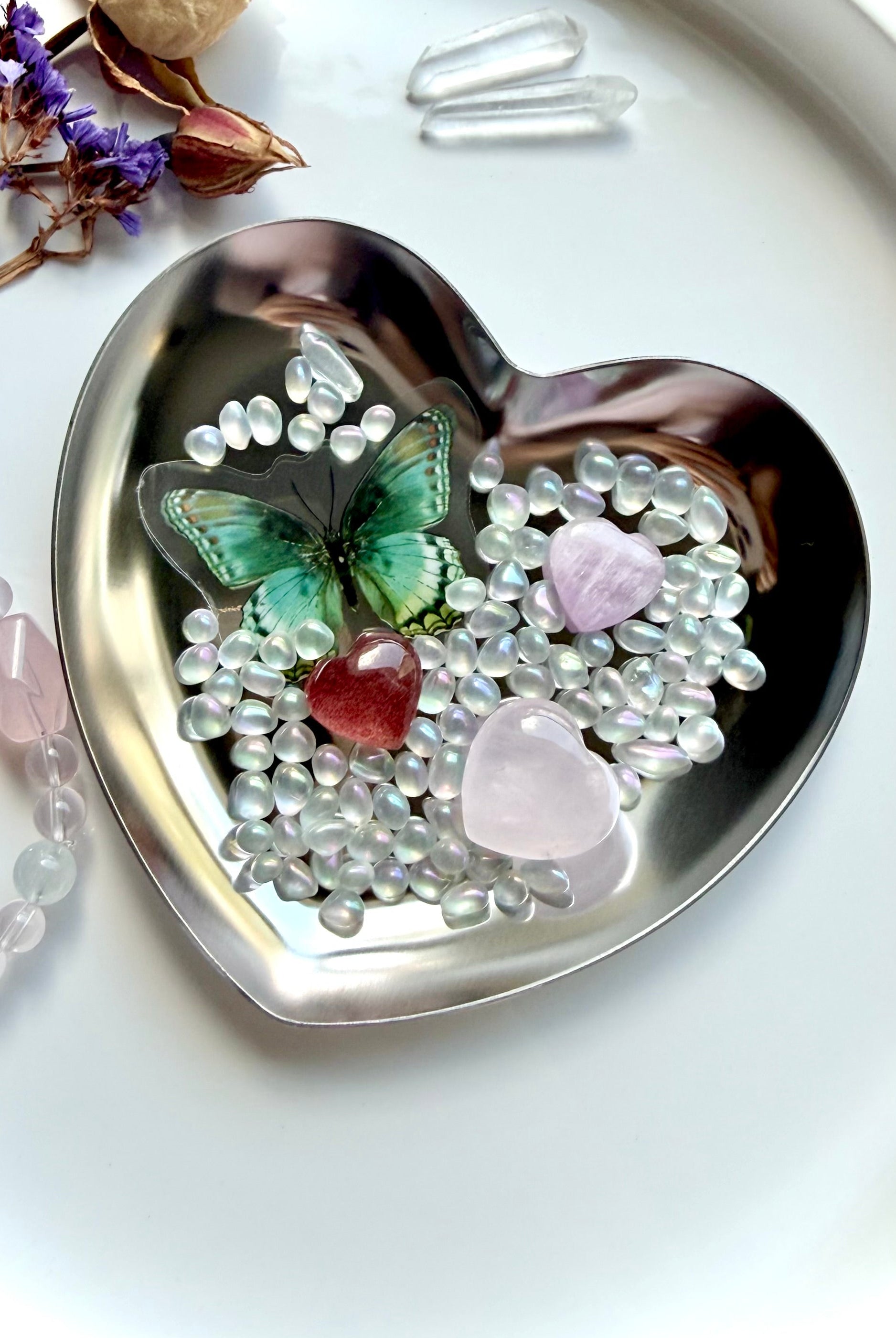 Mini crystal heart gift set with rose quartz, strawberry quartz, and kunzite in a gold heart bowl with aura crystal confetti and butterfly detail