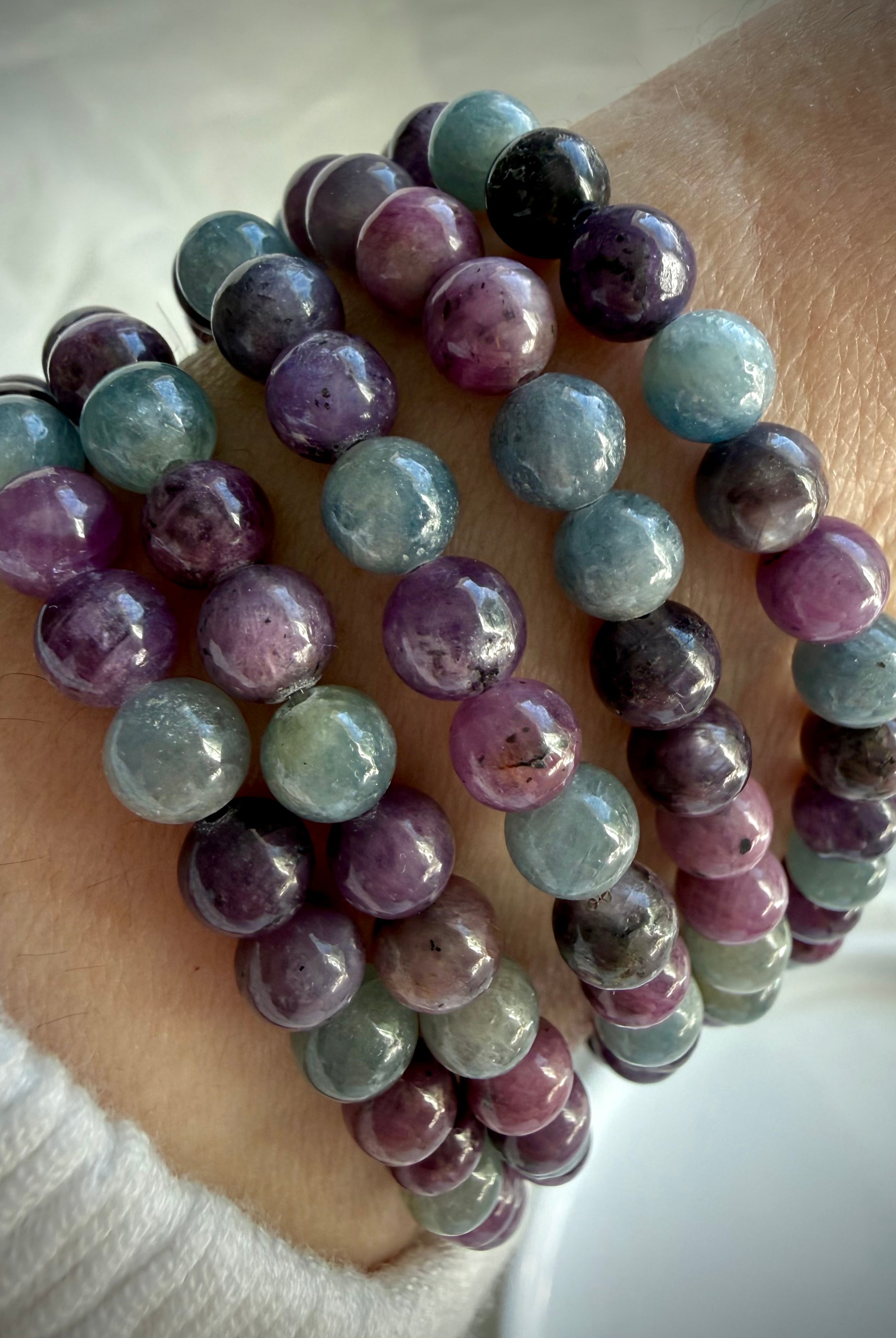 Ruby Sapphire bracelet worn on wrist showing polished natural gemstone beads and comfortable stretch fit