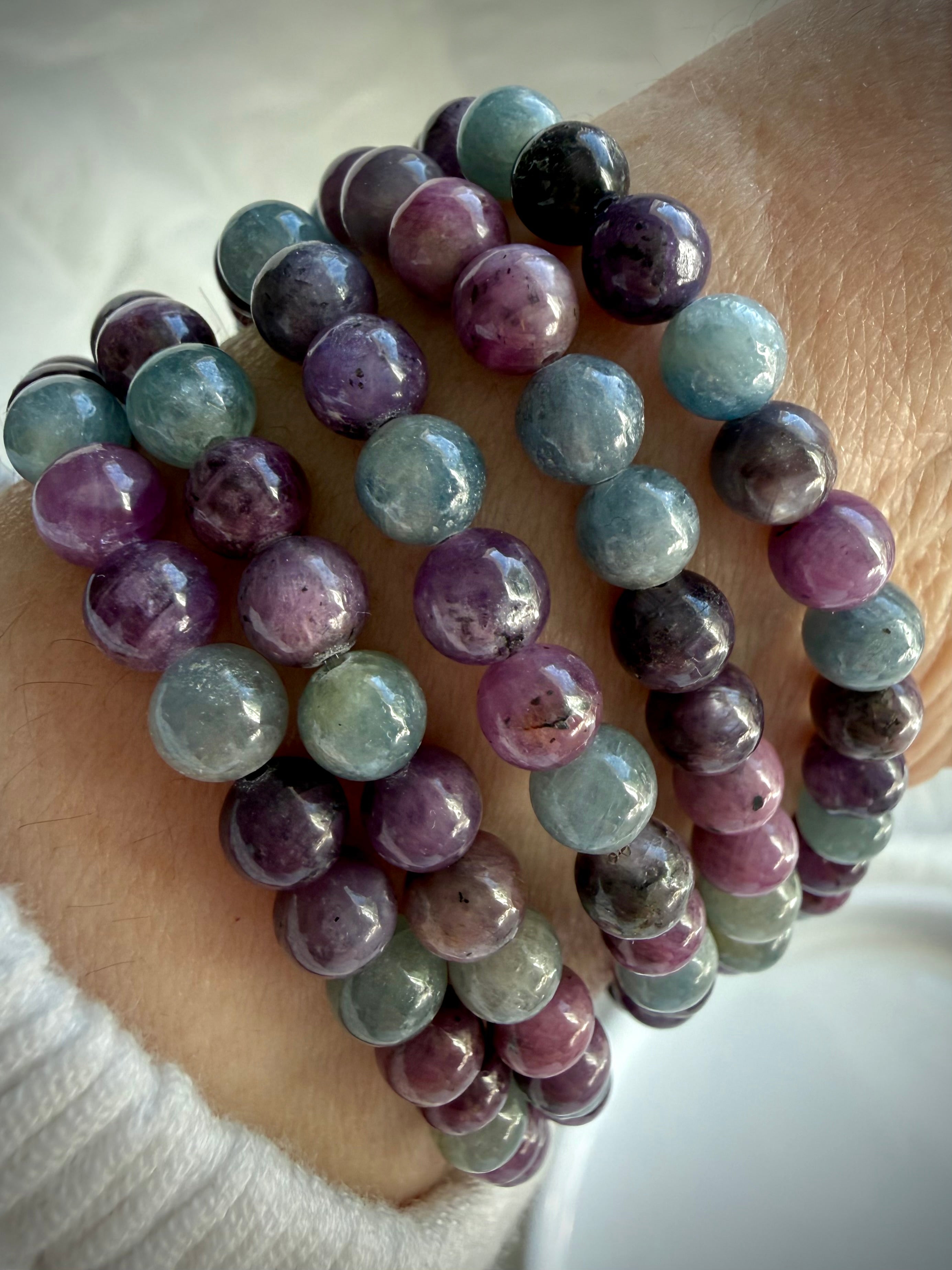 Ruby Sapphire bracelet worn on wrist showing polished natural gemstone beads and comfortable stretch fit