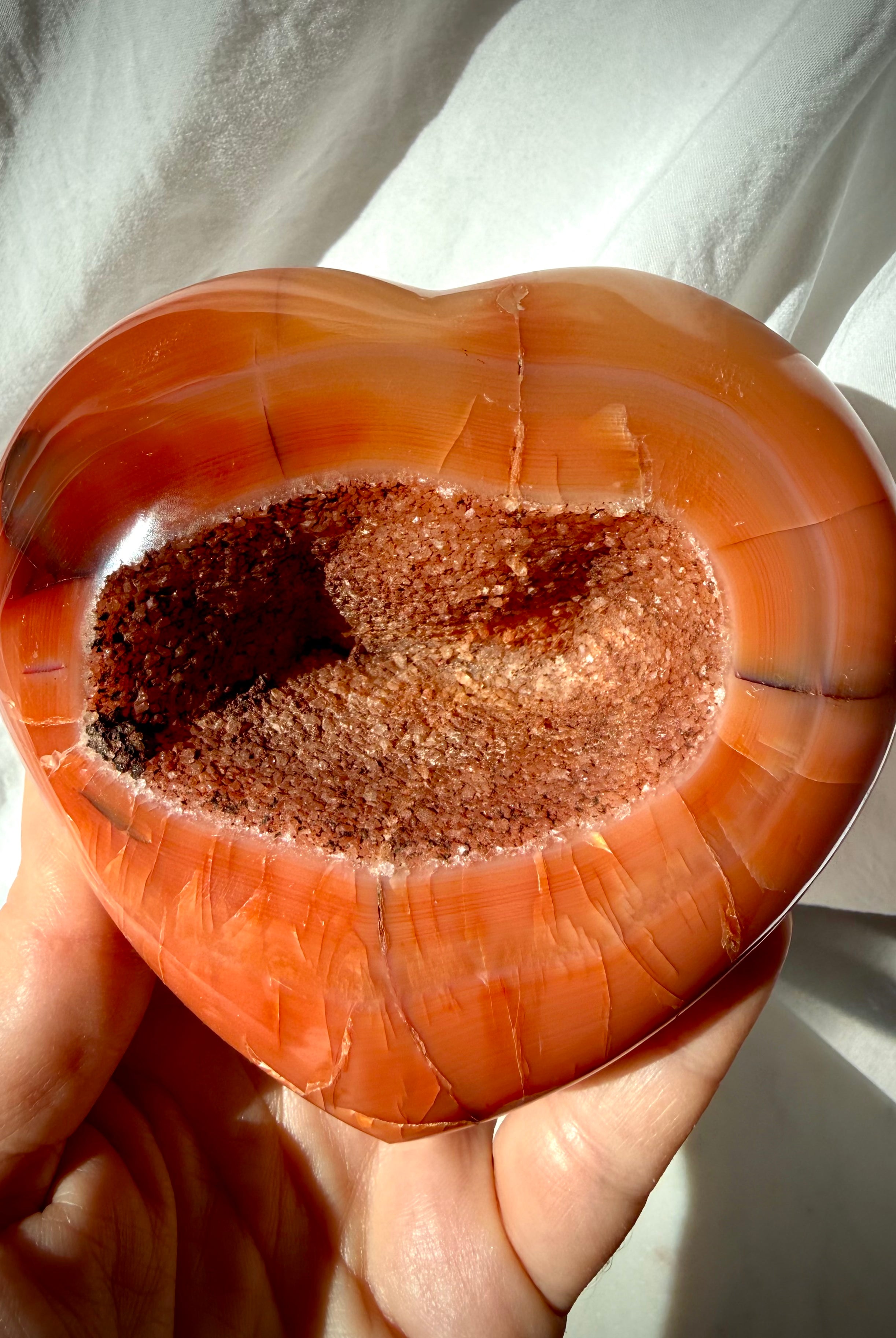 Large Carnelian geode heart crystal with sparkling druzy center and rich red-orange banding