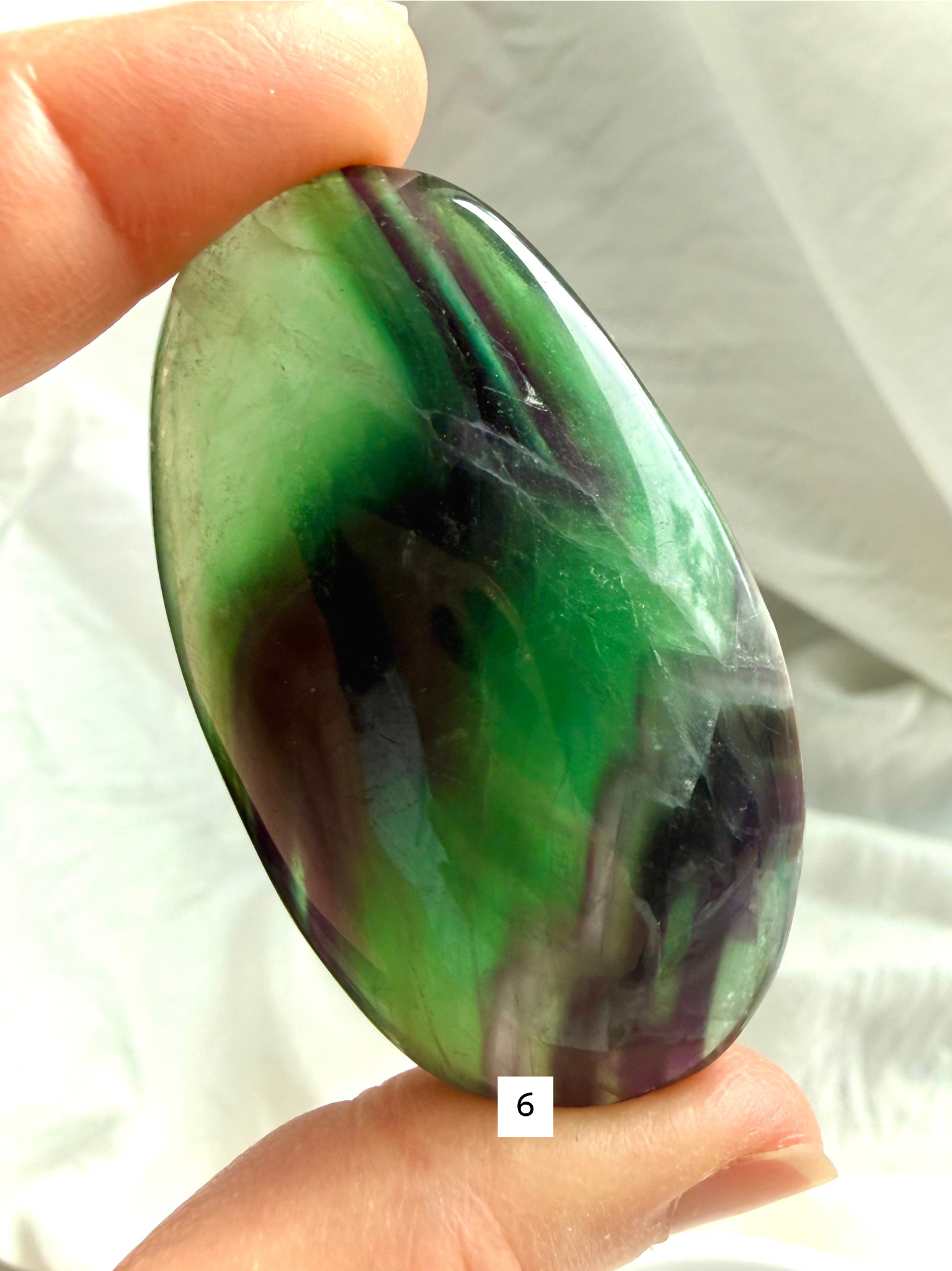 Rainbow Fluorite Palm Stone #6 with rich emerald green bands and subtle blue translucency