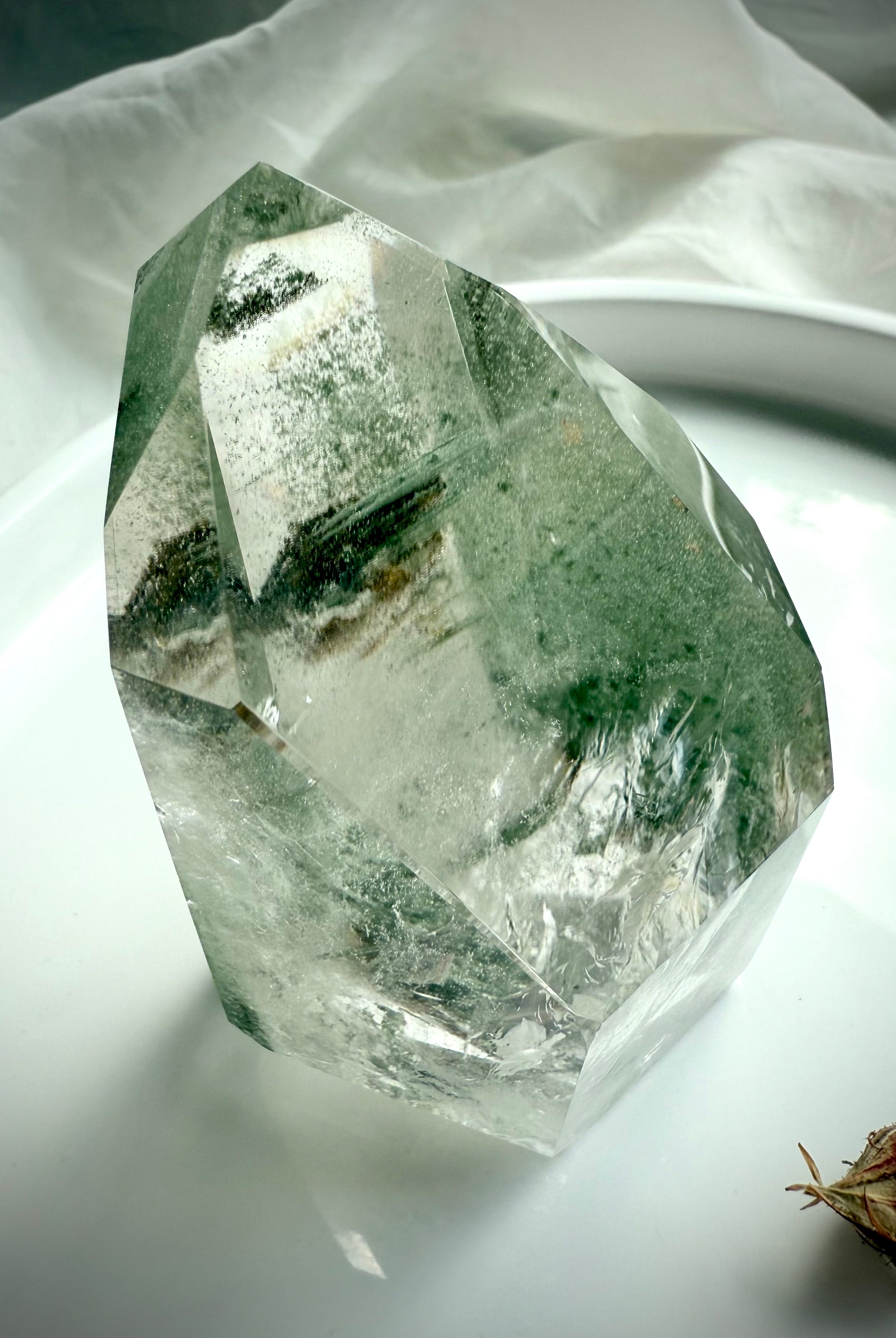 Lodolite crystal tower with lush green mineral formations and beautiful internal depth