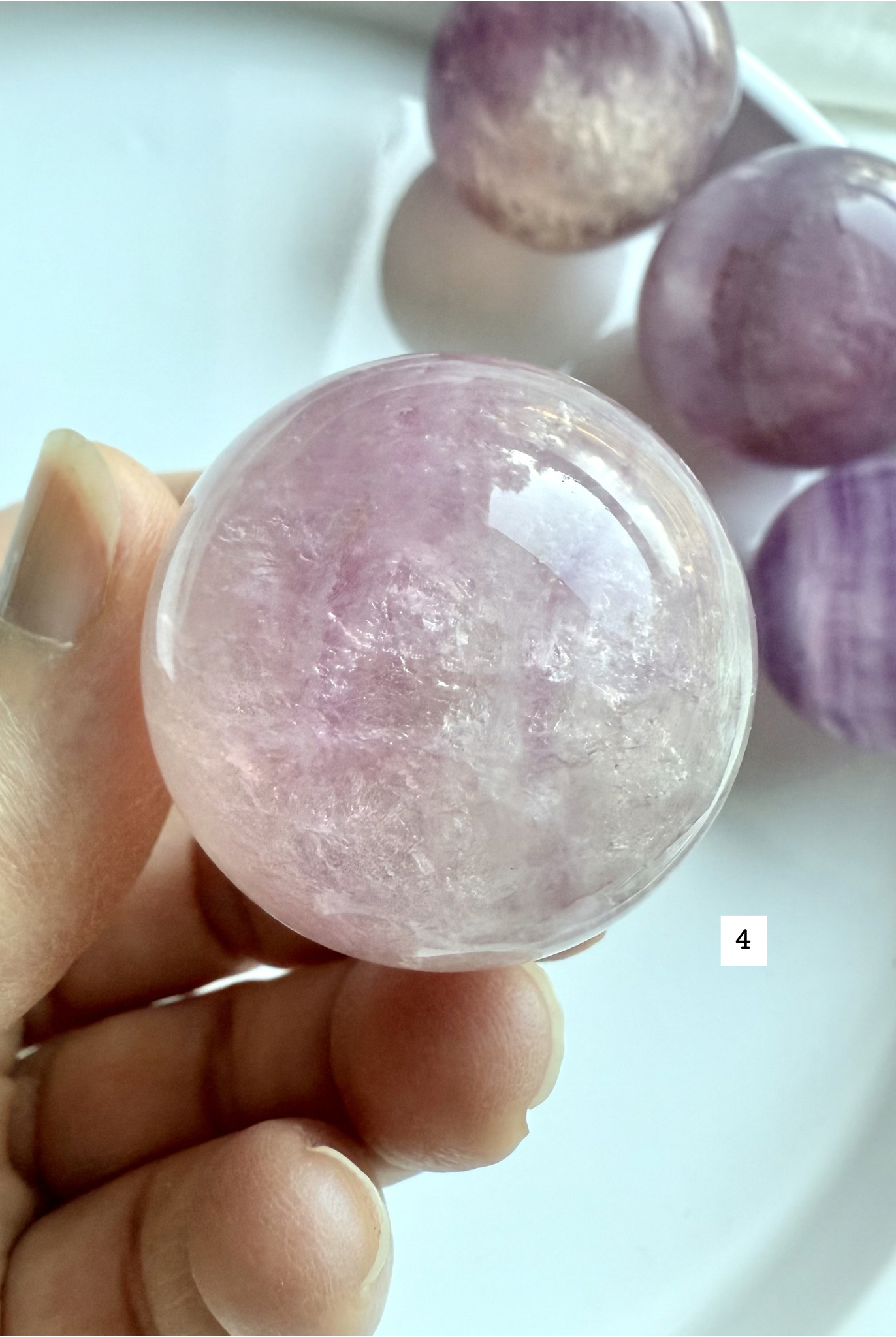 translucent Silky Magenta Fluorite sphere with soft pink and violet tones for heart and third eye chakras
